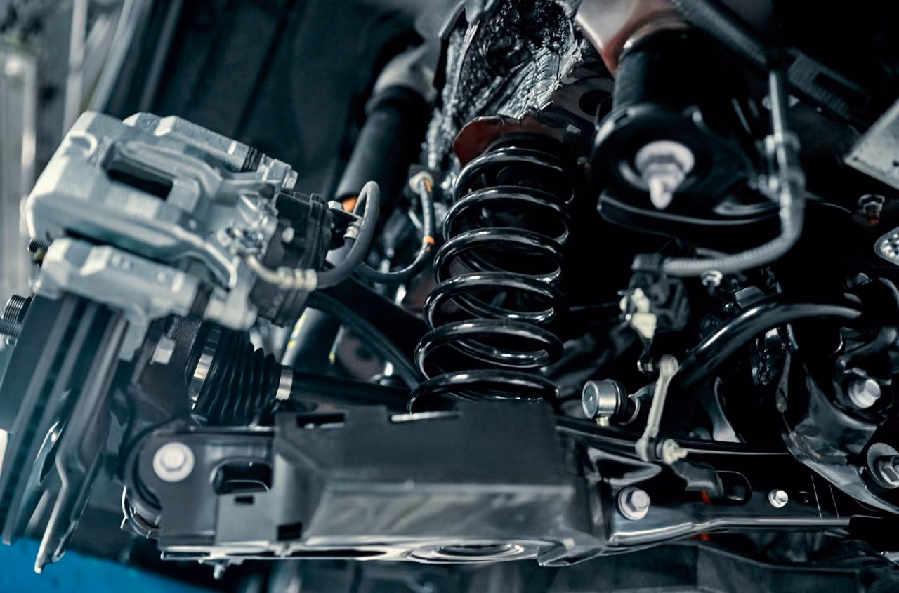 Suspension spring and components under a car during a suspension repair