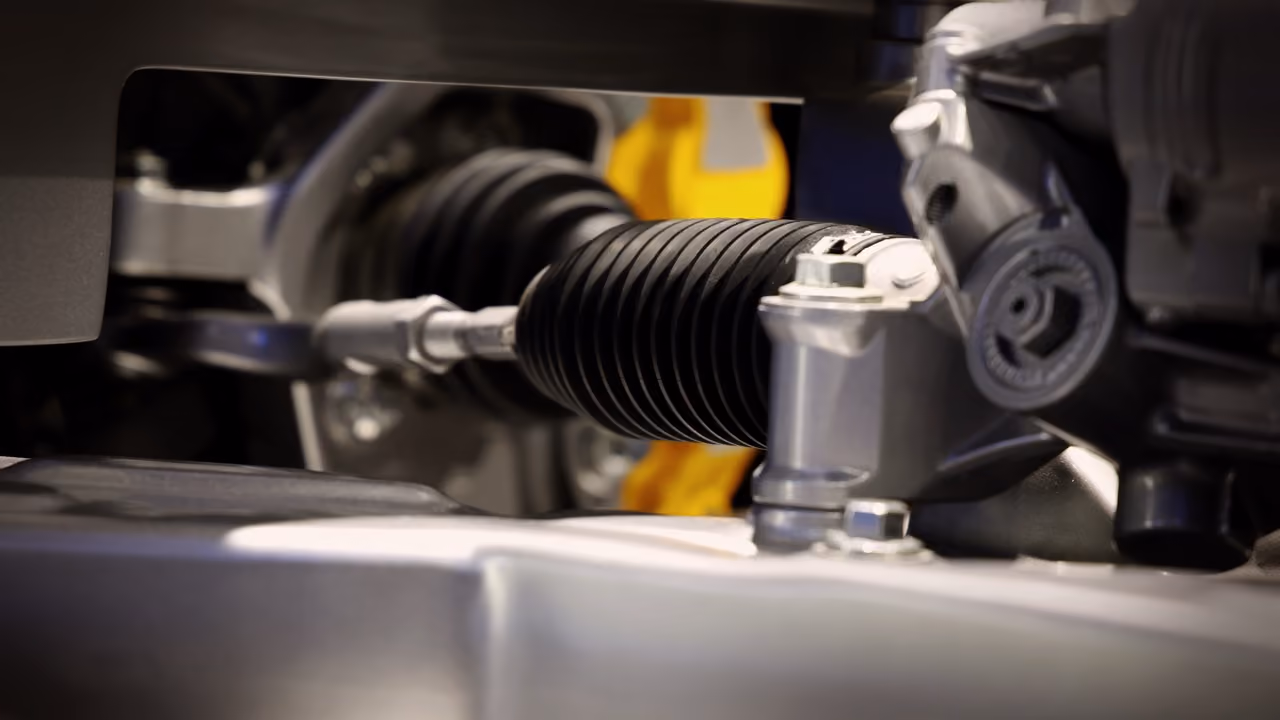 Close-up of a steering rack and gaiter during a steering repair