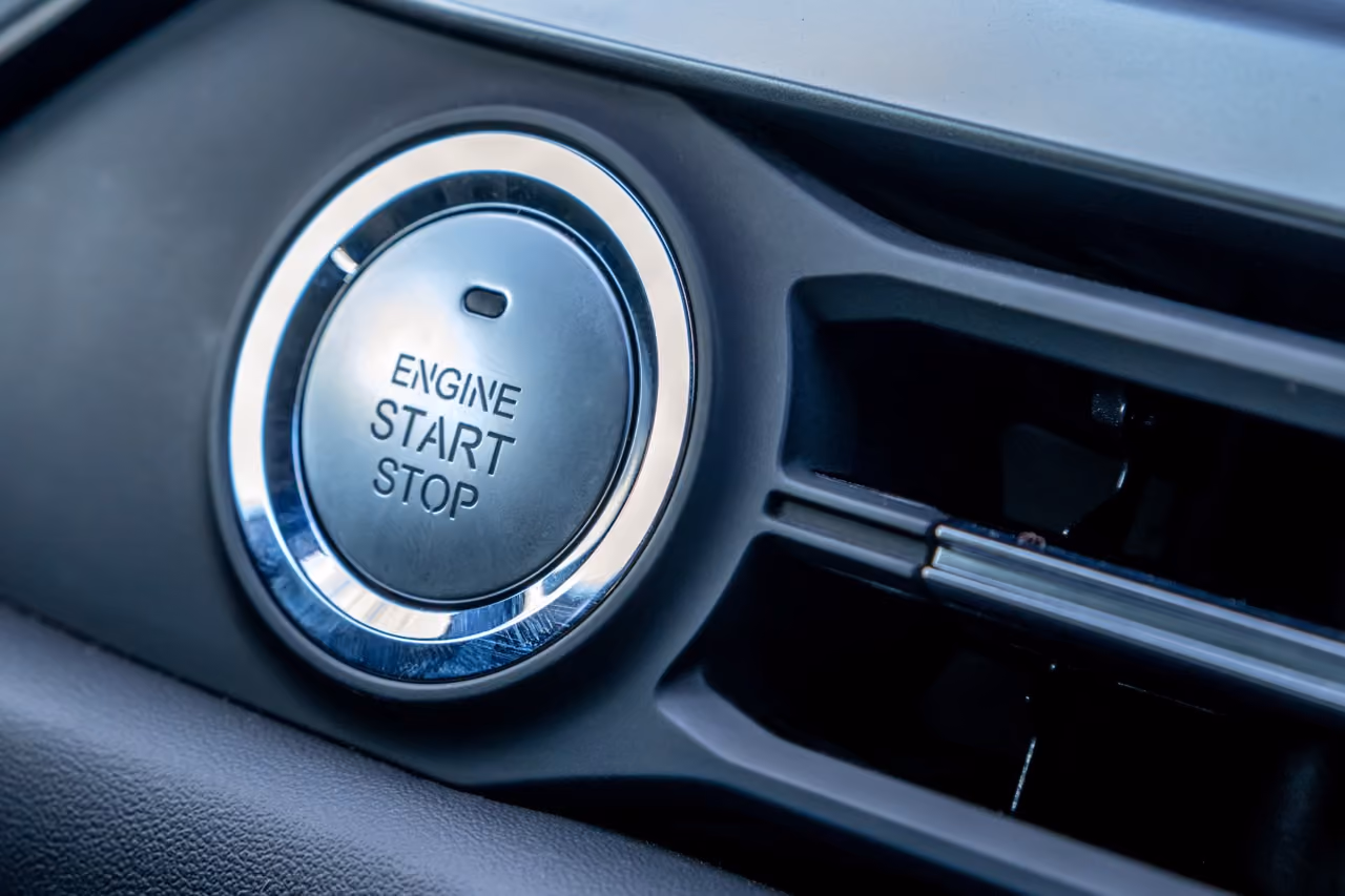 Close-up of a car's engine start-stop button