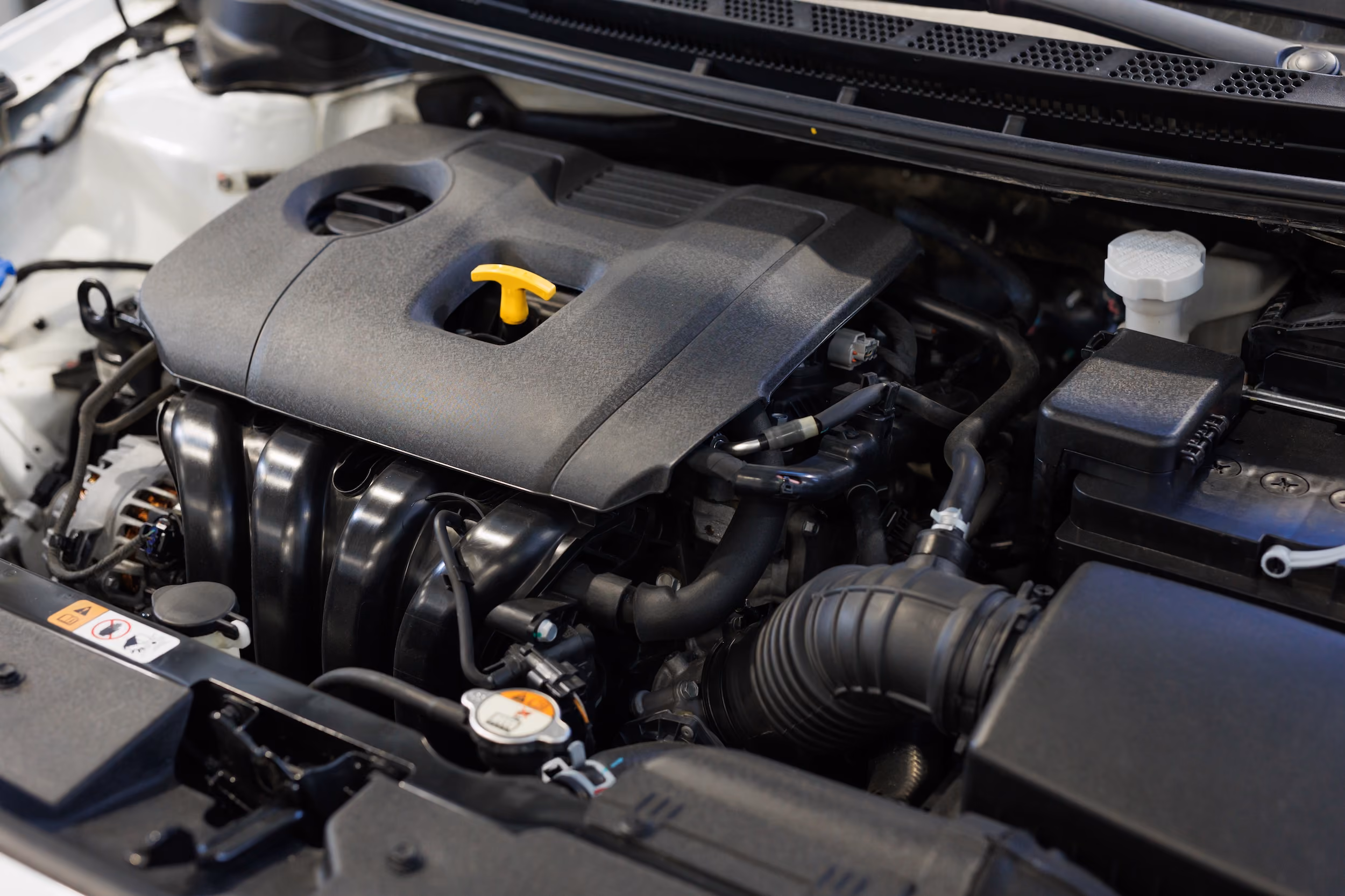 Car engine bay ready for mobile engine maintenance and repairs