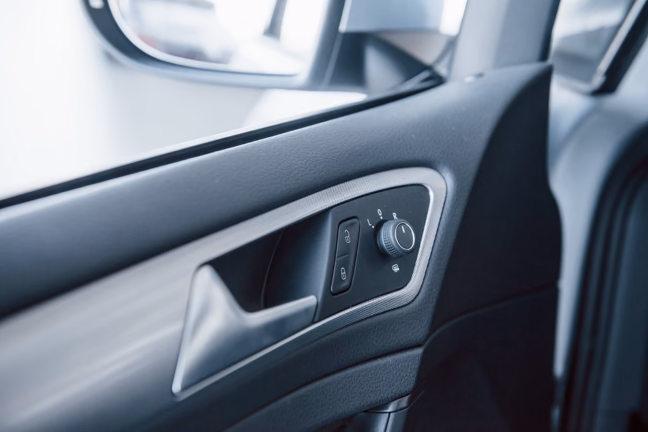 Car door interior with electric window controls for a window repair