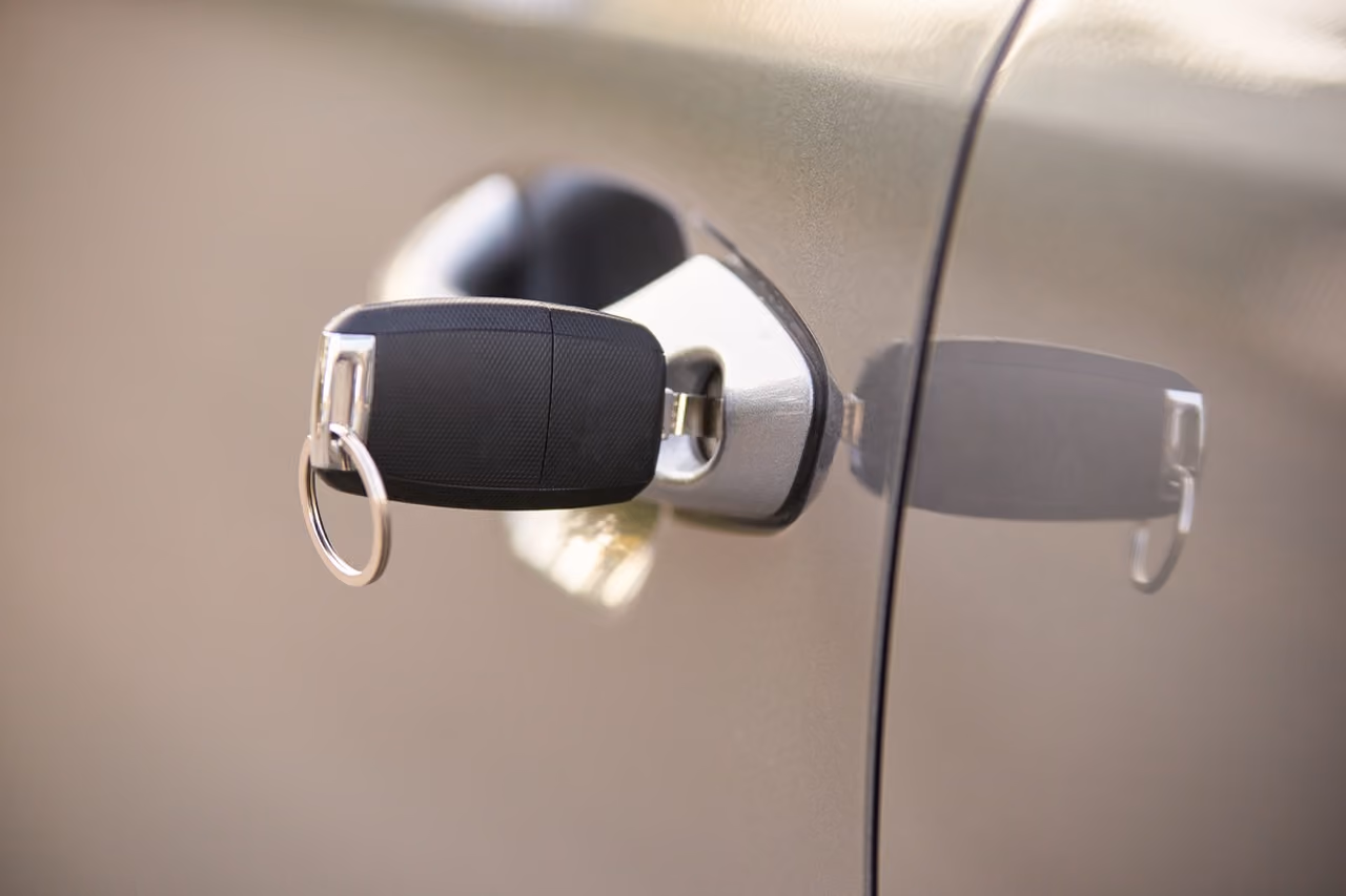 Key in a car door lock during a door lock repair