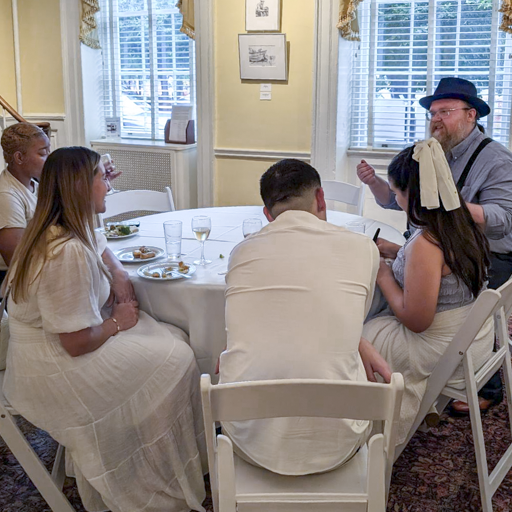 Craig entertains guests at an event table