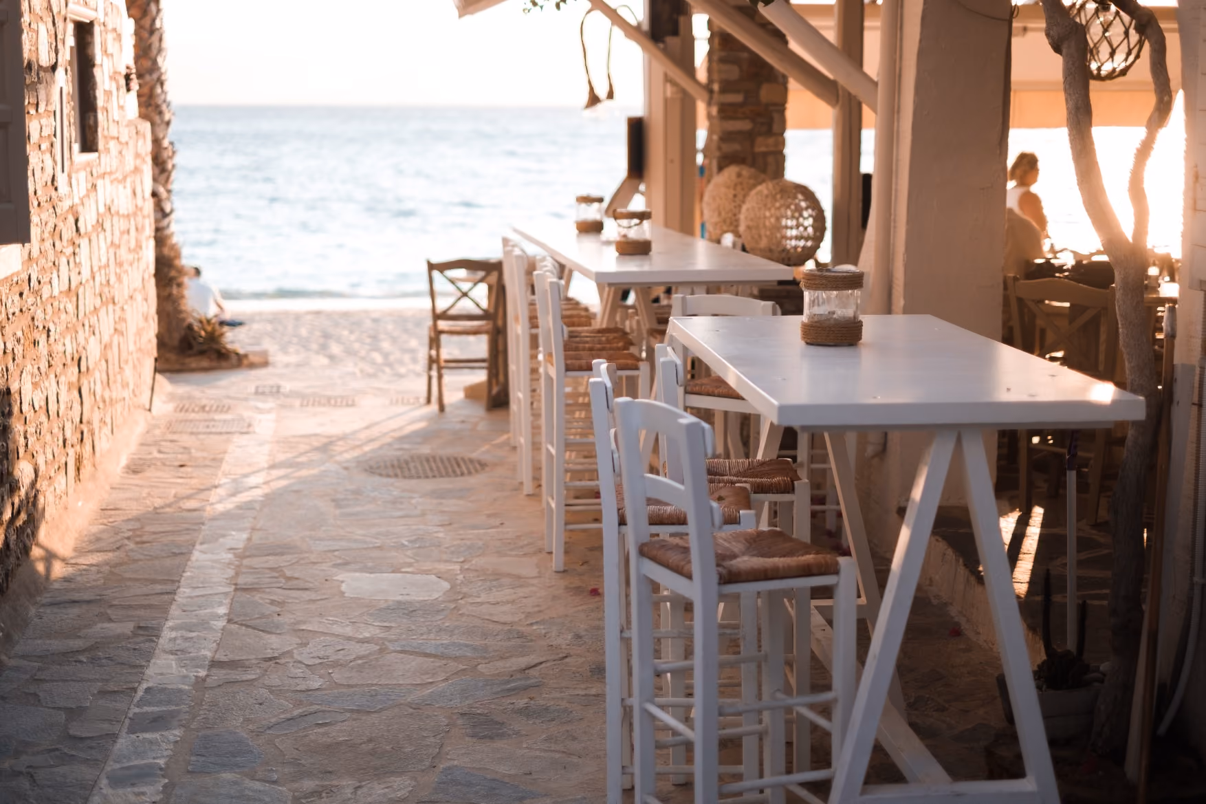 Rustic dining table with bar stools in a timber interior