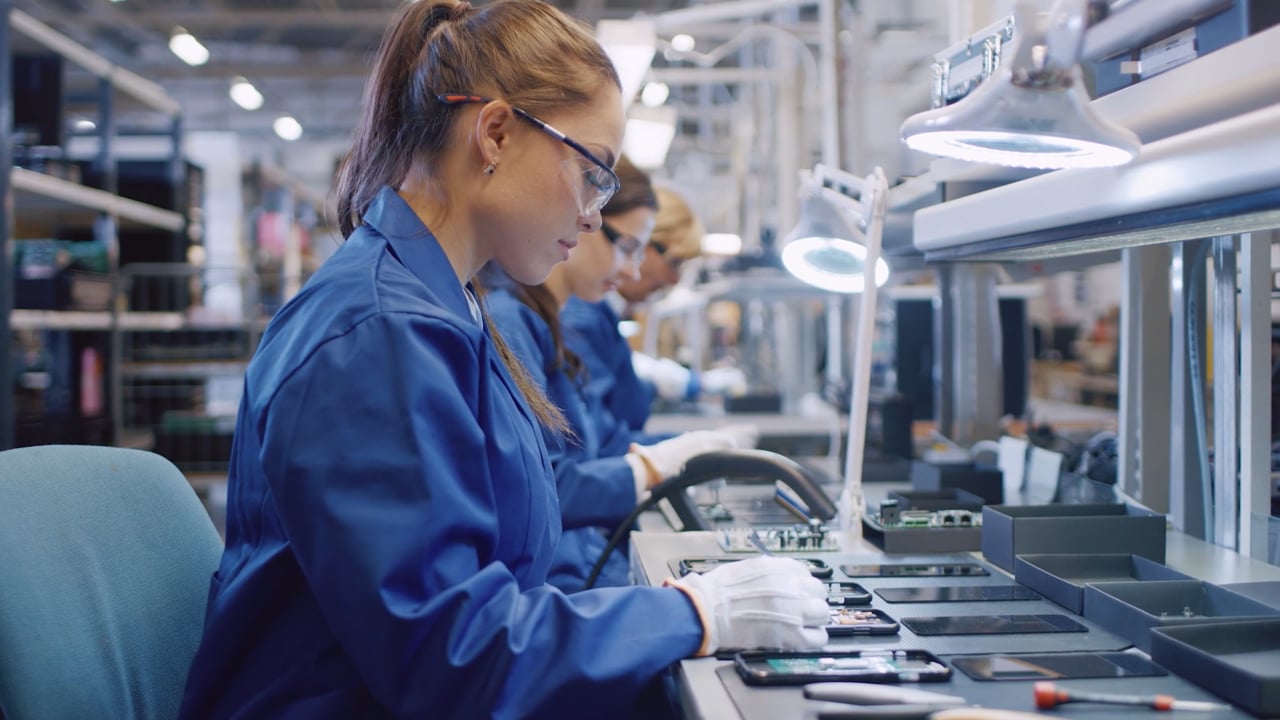 Woman working at an electronics workstation in the YES brand film