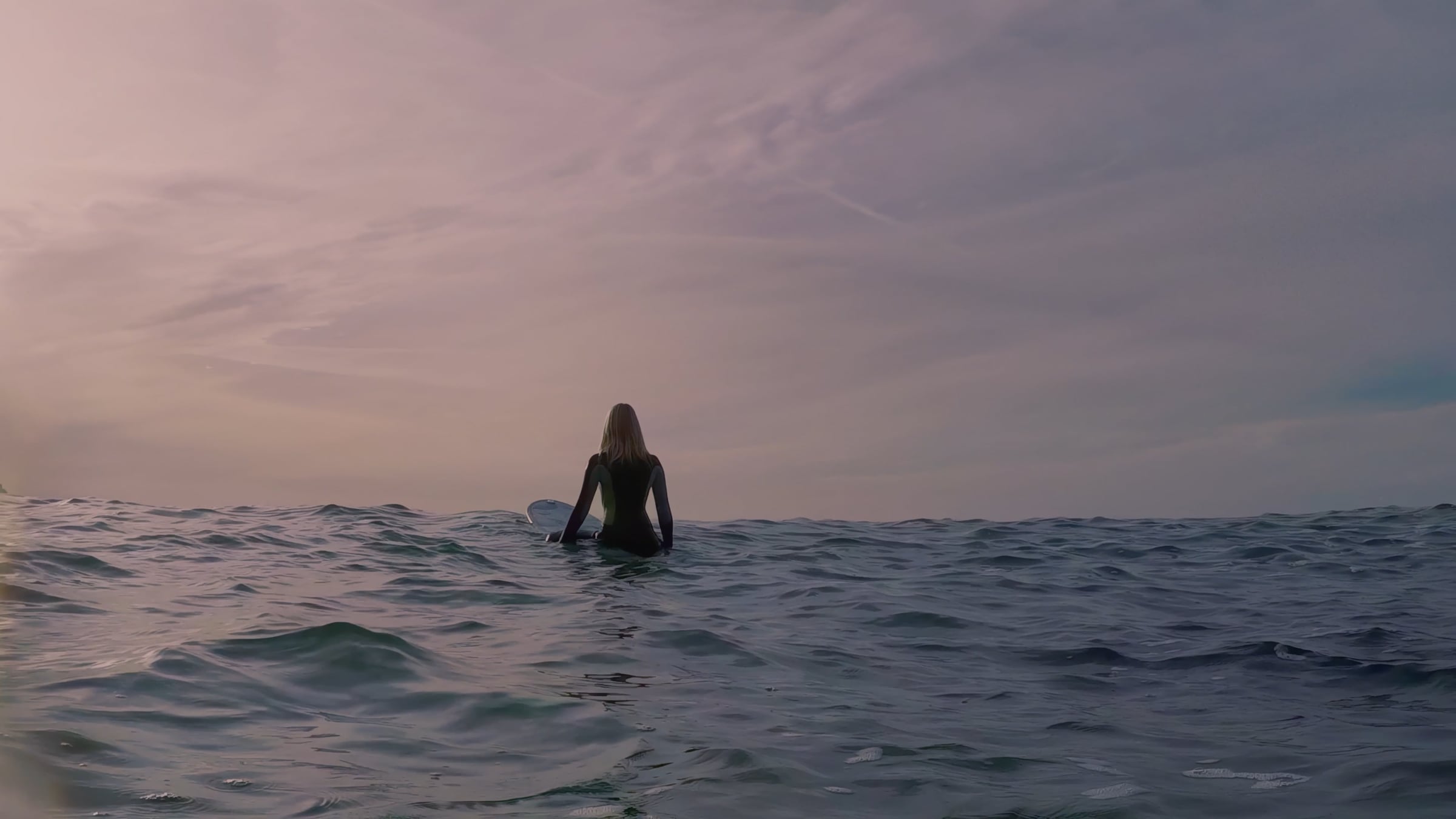 Surfer on the ocean in Deloitte Climate Week NYC Water video