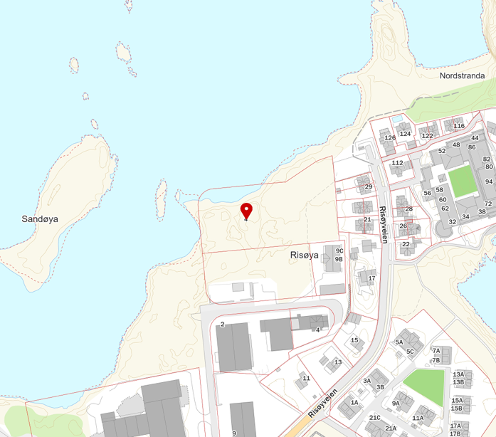 Map showing Risøya island area with marked location pin and nearby Sandøya island in water.