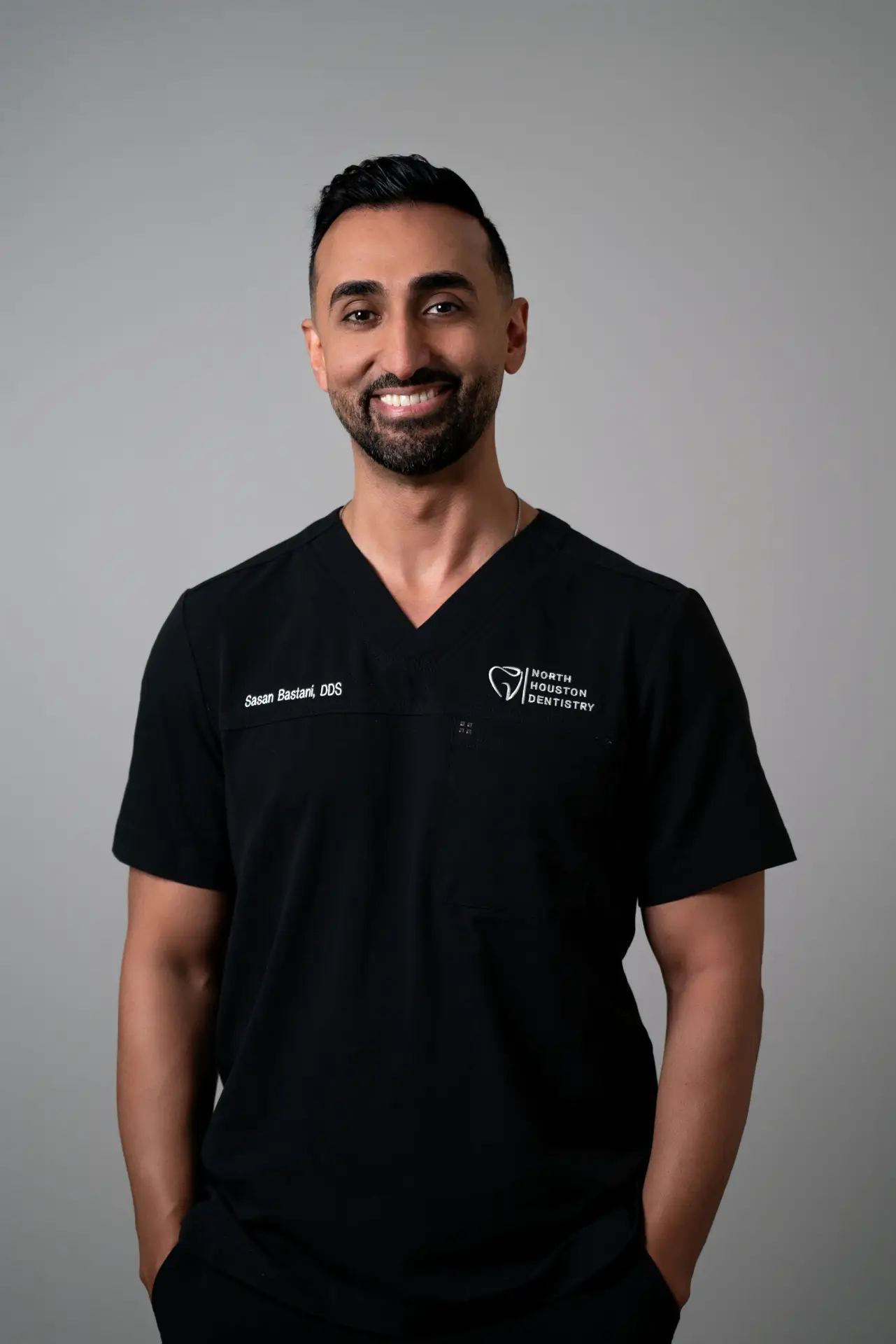 Dr. Sasan Bastani, DDS, in North Houston Dentistry scrubs