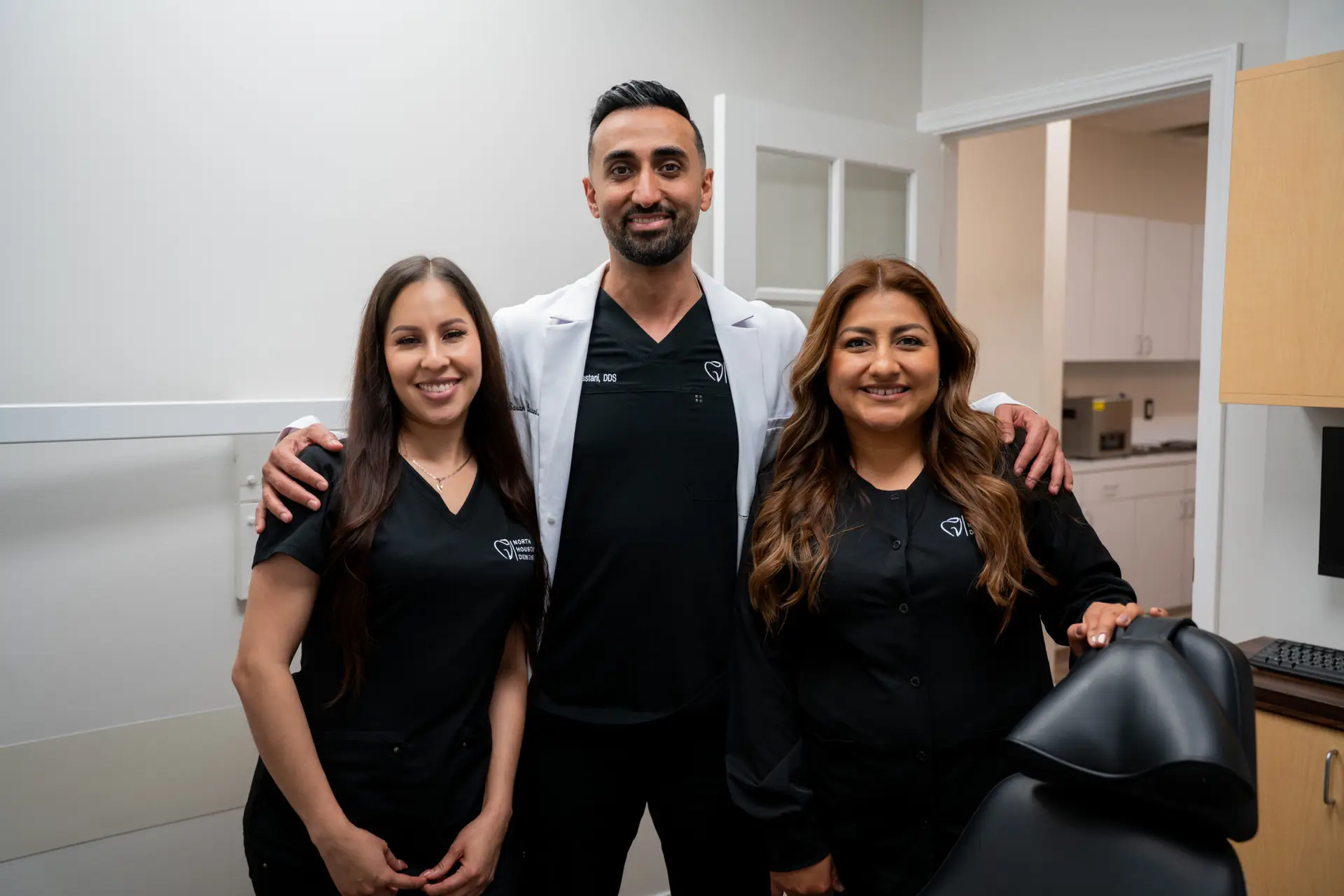 Dr. Sasan Bastani with two members of his team in a North Houston Dentistry treatment room