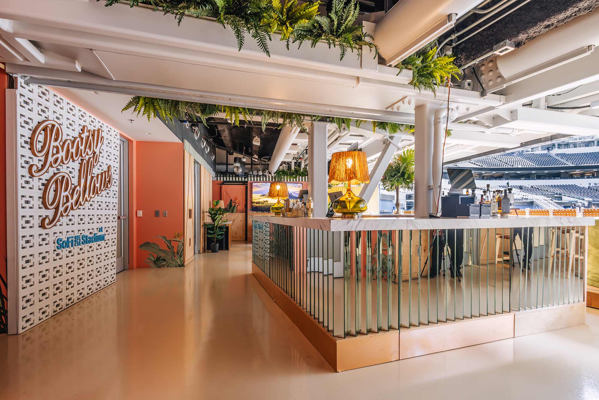 Bootsy Bellows suite at SoFi Stadium with bar and stadium views
