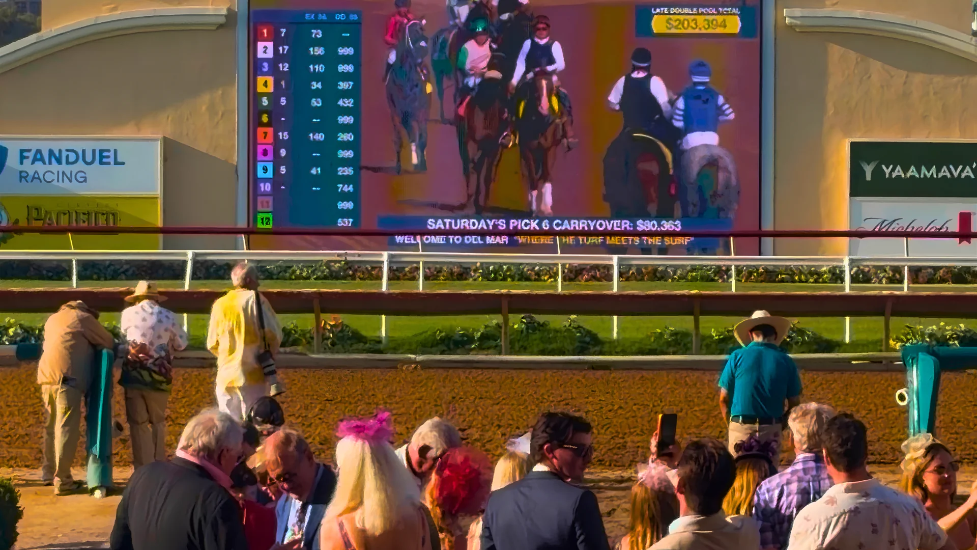 The Del Mar infield board showing live odds, pool totals and the Pick 6 carryover