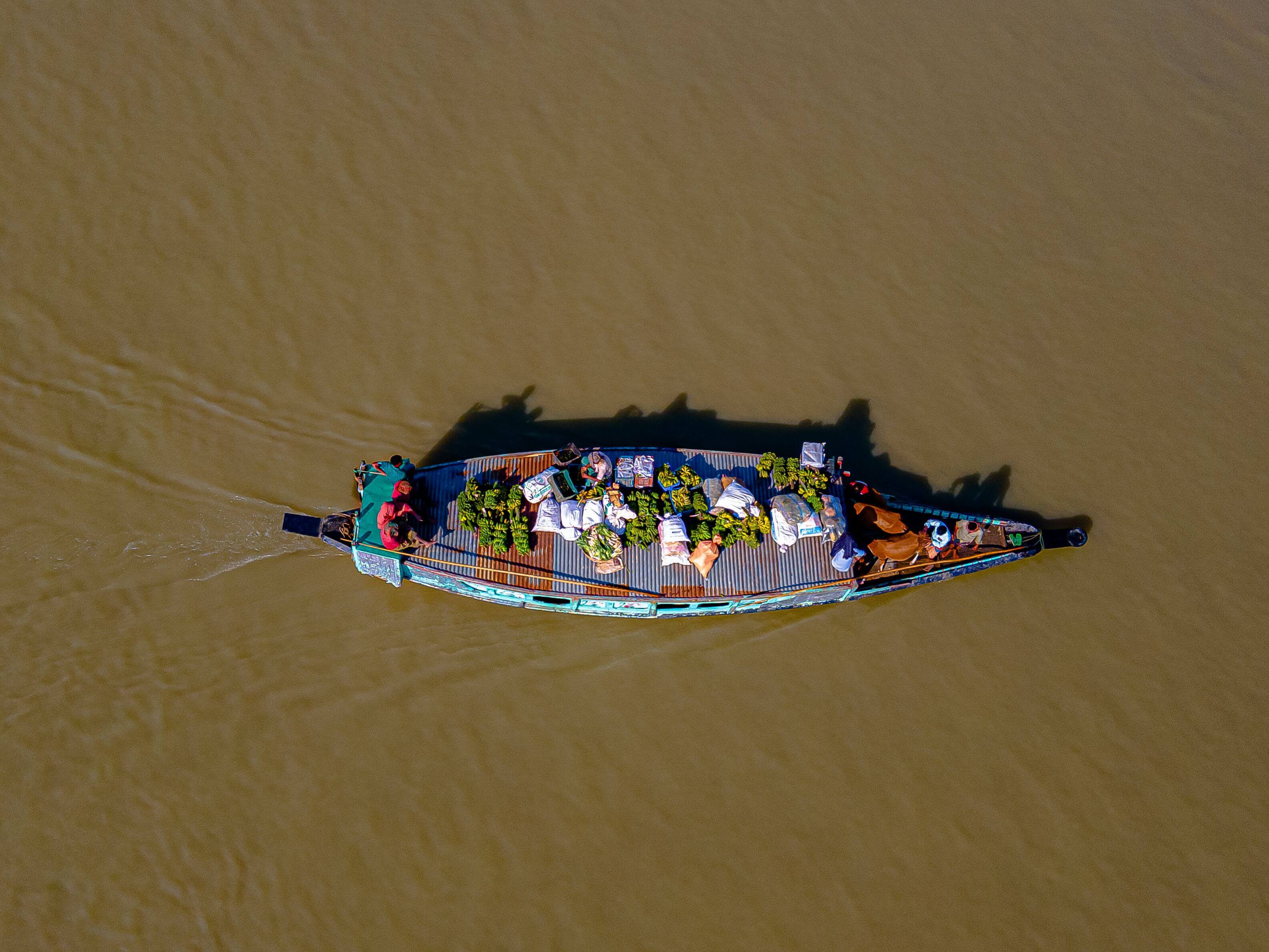 Aerial top-down view of a colorful food spread with various ingredients representing fresh food cargo