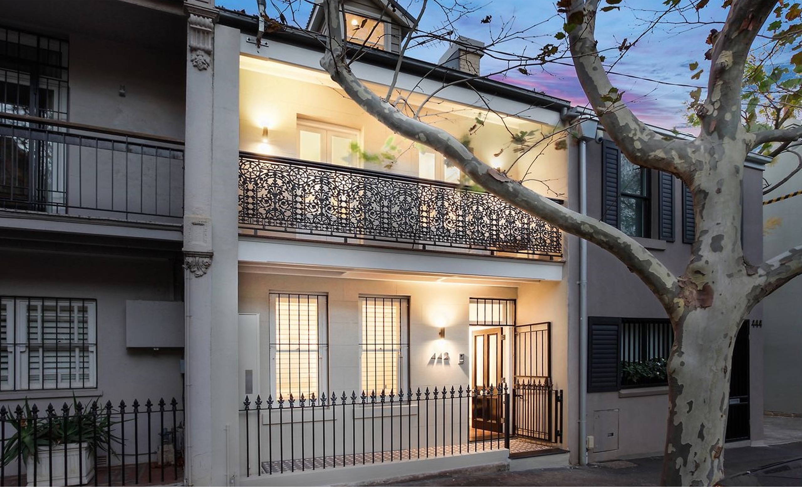 Restored terrace facade at dusk at Bourke St, Surry Hills by Sydneyside Contracting