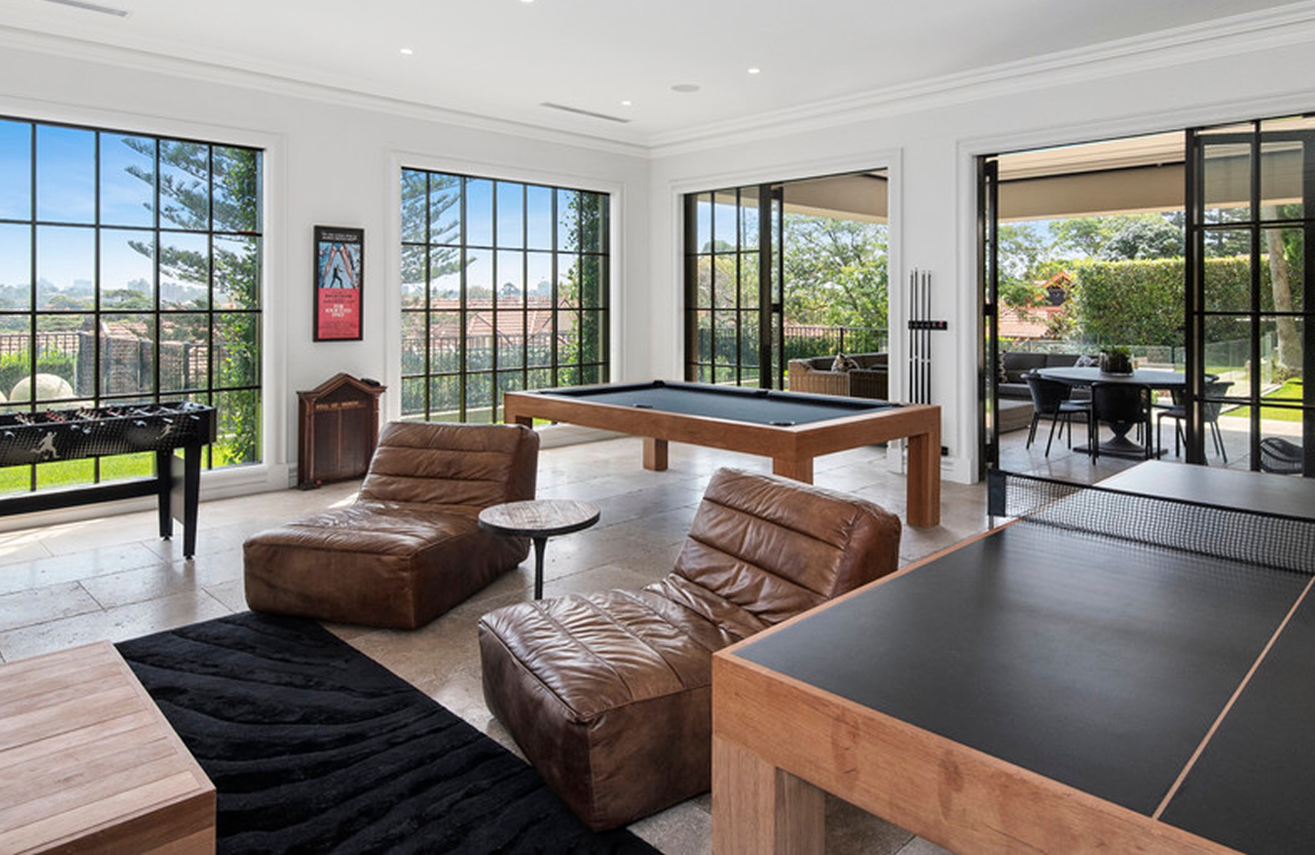 Games room opening to the garden at 13 Ruby St, Mosman by Sydneyside Contracting
