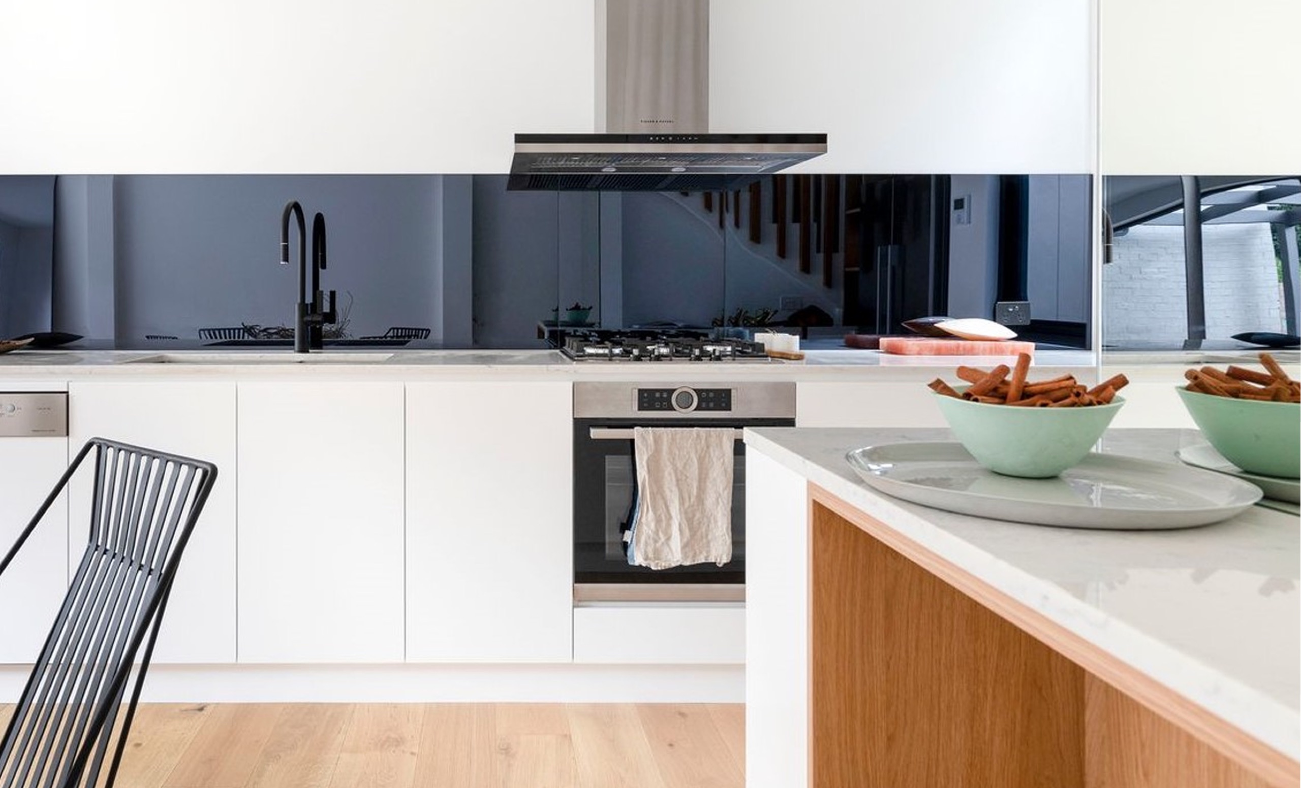 Kitchen with navy splashback at Marriot St, Redfern by Sydneyside Contracting