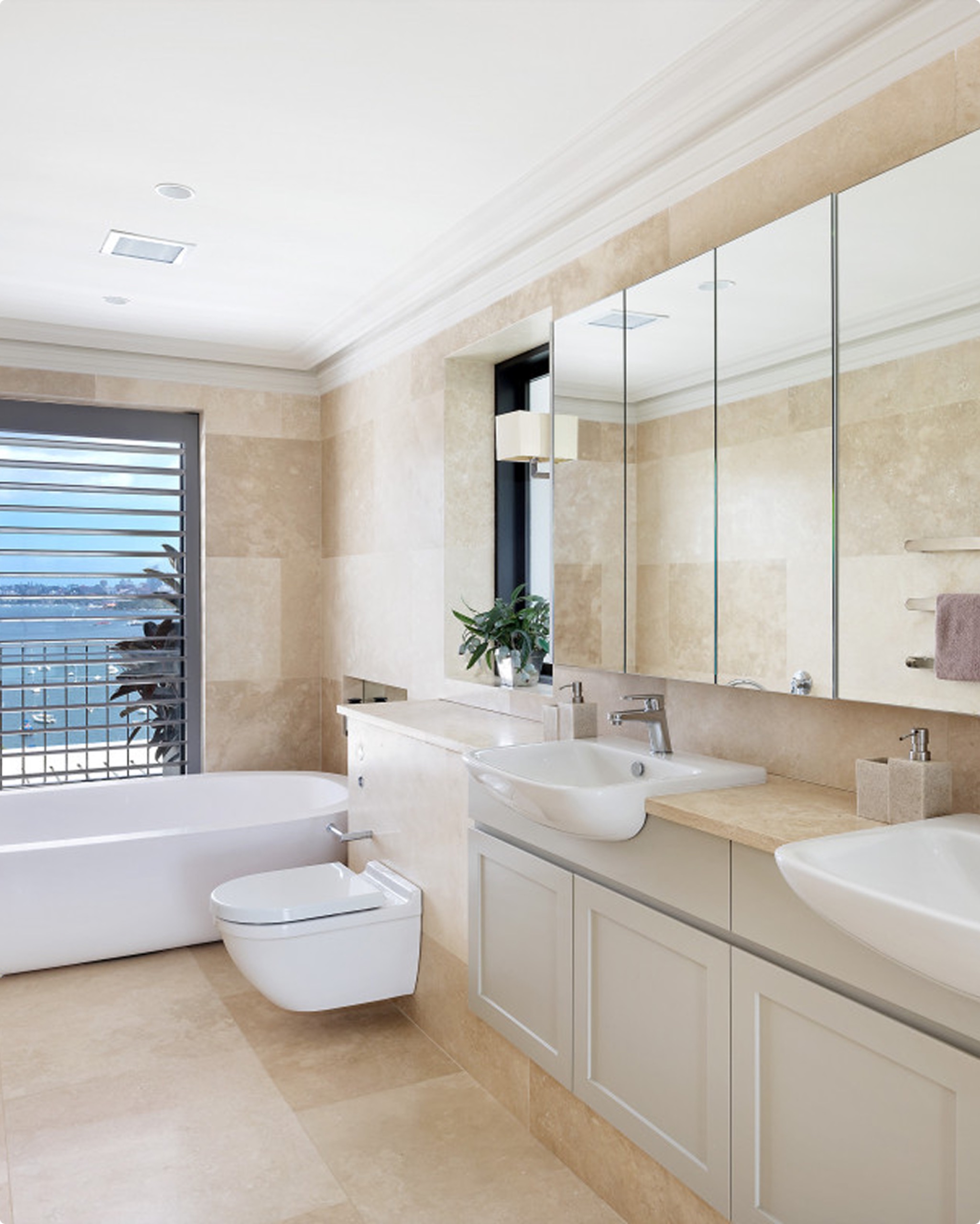 Travertine bathroom at Clanalpine St, Mosman by Sydneyside Contracting