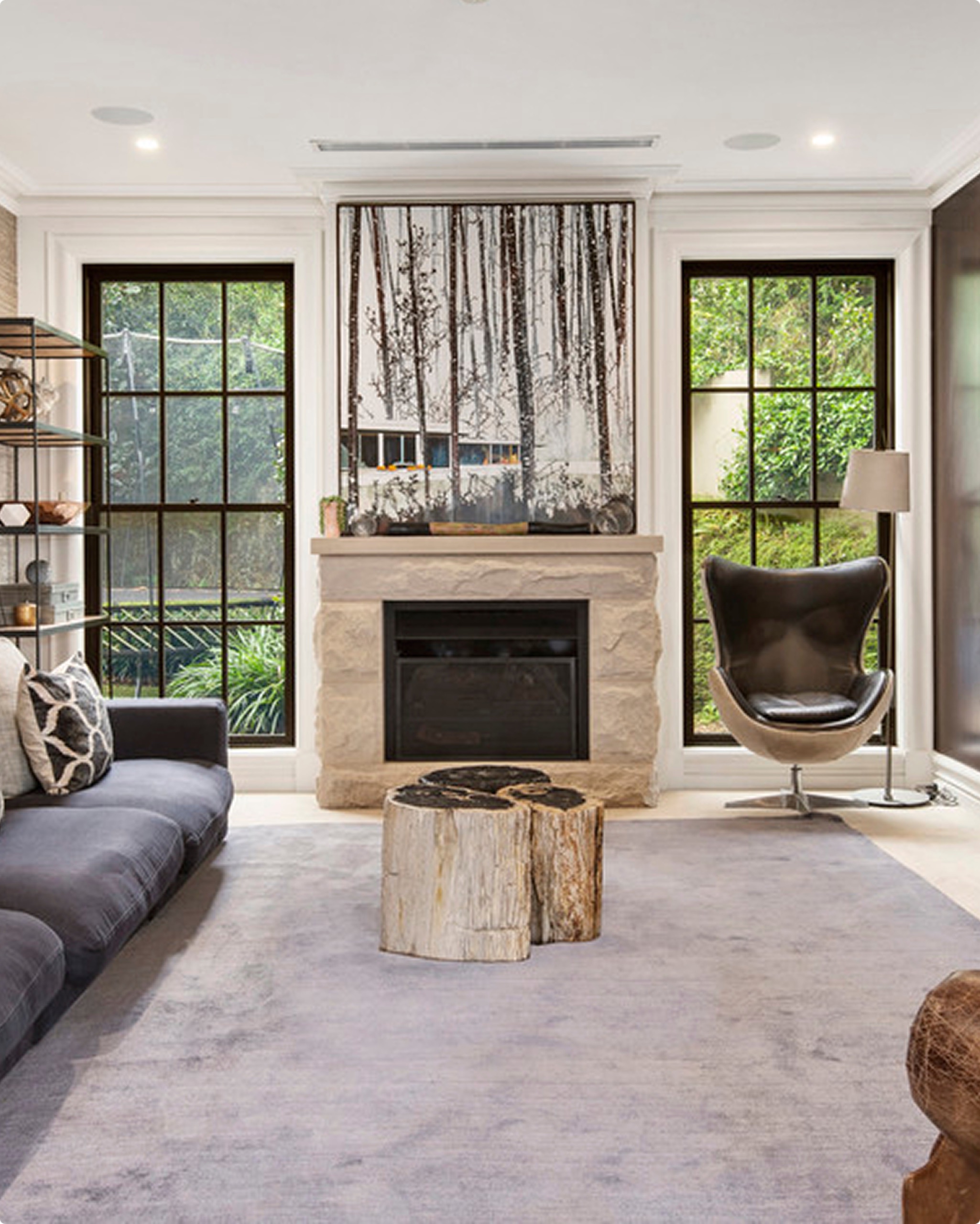 Living room with stone fireplace at 13 Ruby St, Mosman by Sydneyside Contracting