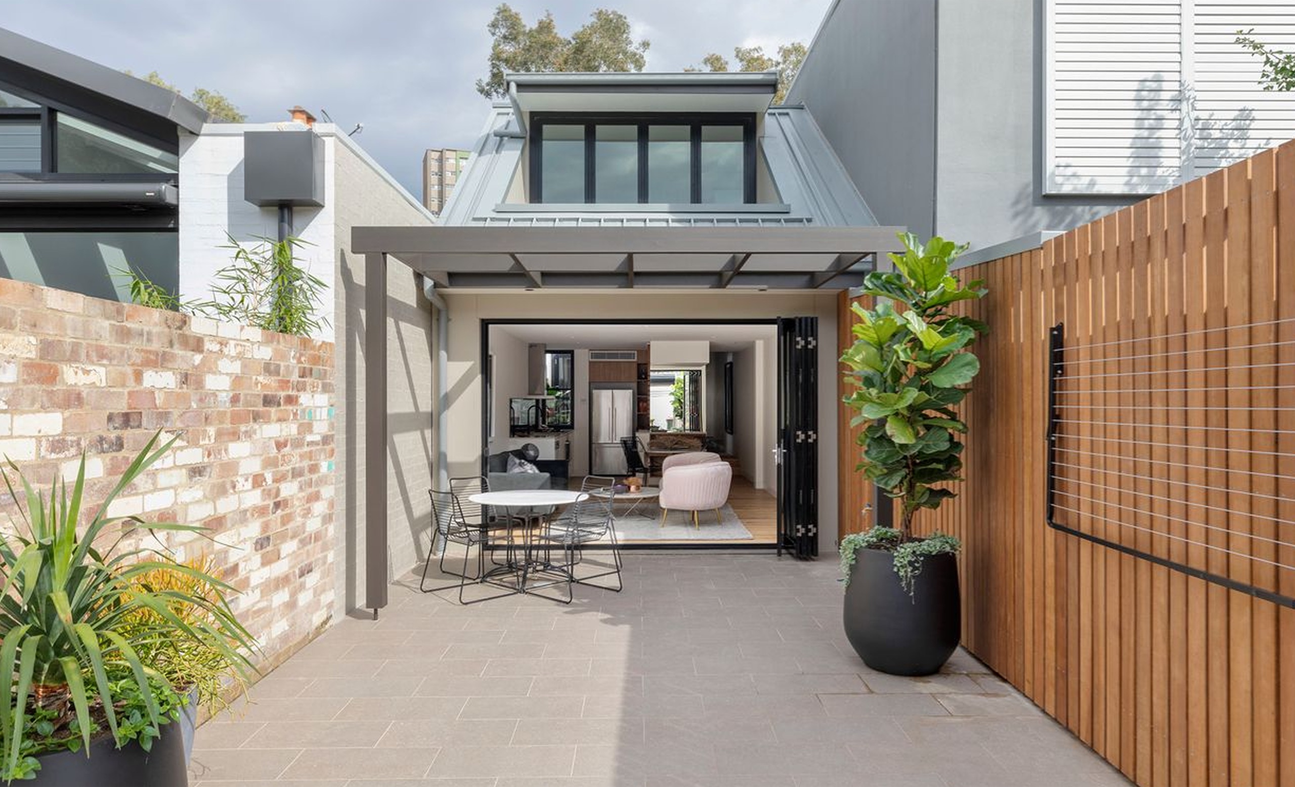 Rear courtyard and skylit extension at Marriot St, Redfern by Sydneyside Contracting