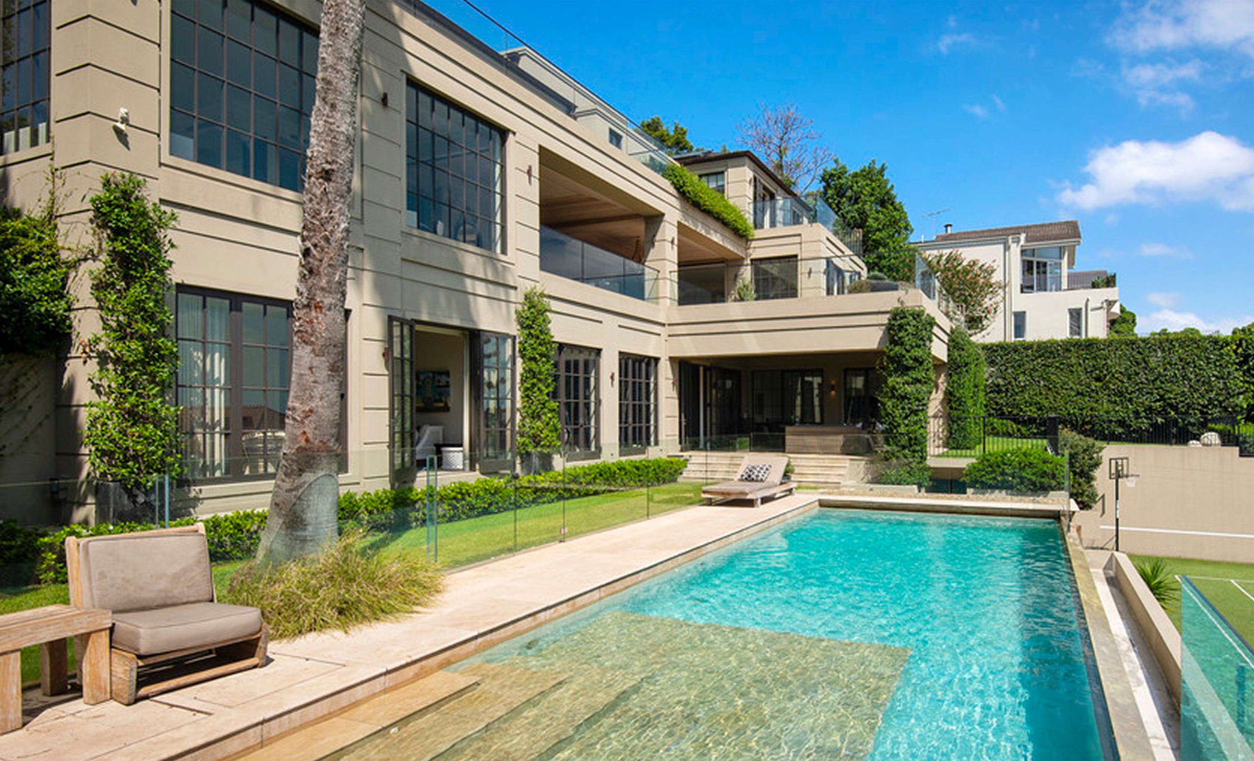 Pool and rear garden at dusk at 13 Ruby St, Mosman by Sydneyside Contracting