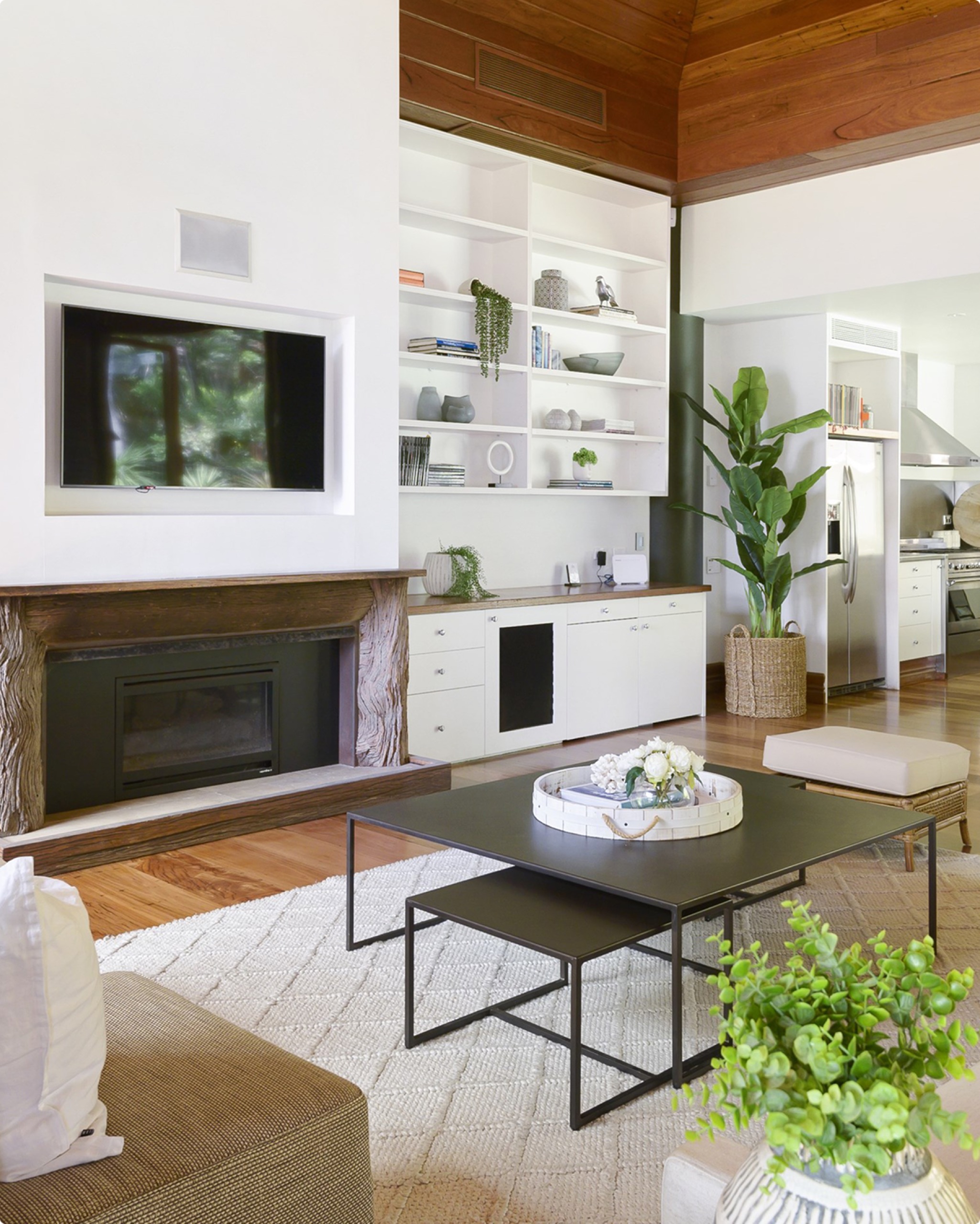 Living room with fireplace and joinery at Ocean Rd, Palm Beach by Sydneyside Contracting