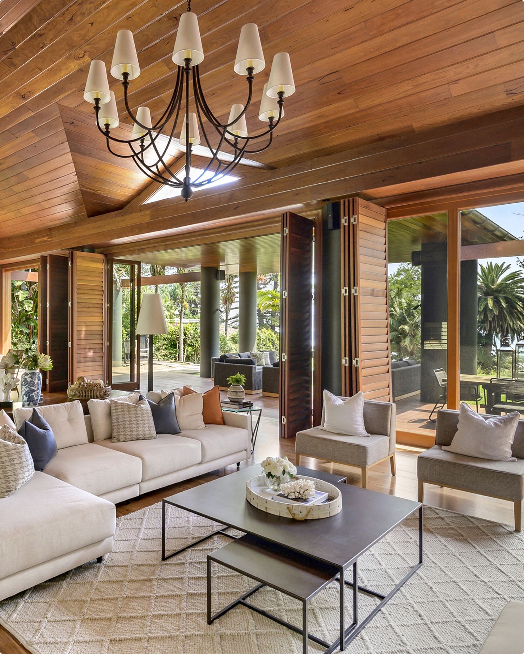 Living room beneath a raked timber ceiling at Ocean Rd, Palm Beach by Sydneyside Contracting