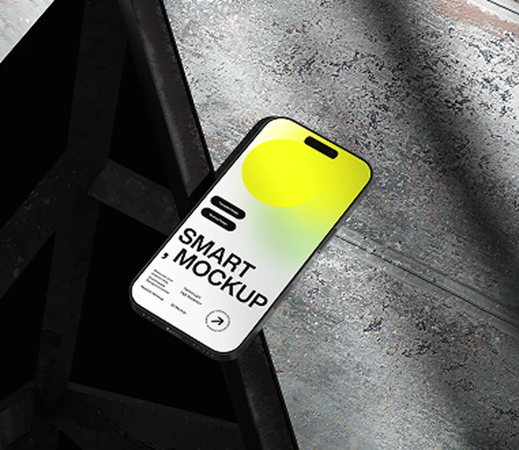 Smartphone lying on a metallic surface displaying a colorful smart mockup screen.