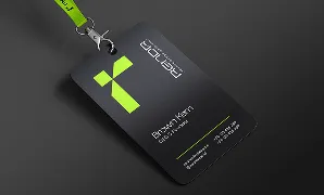 Black conference badge with green geometric logo and white text on dark background.