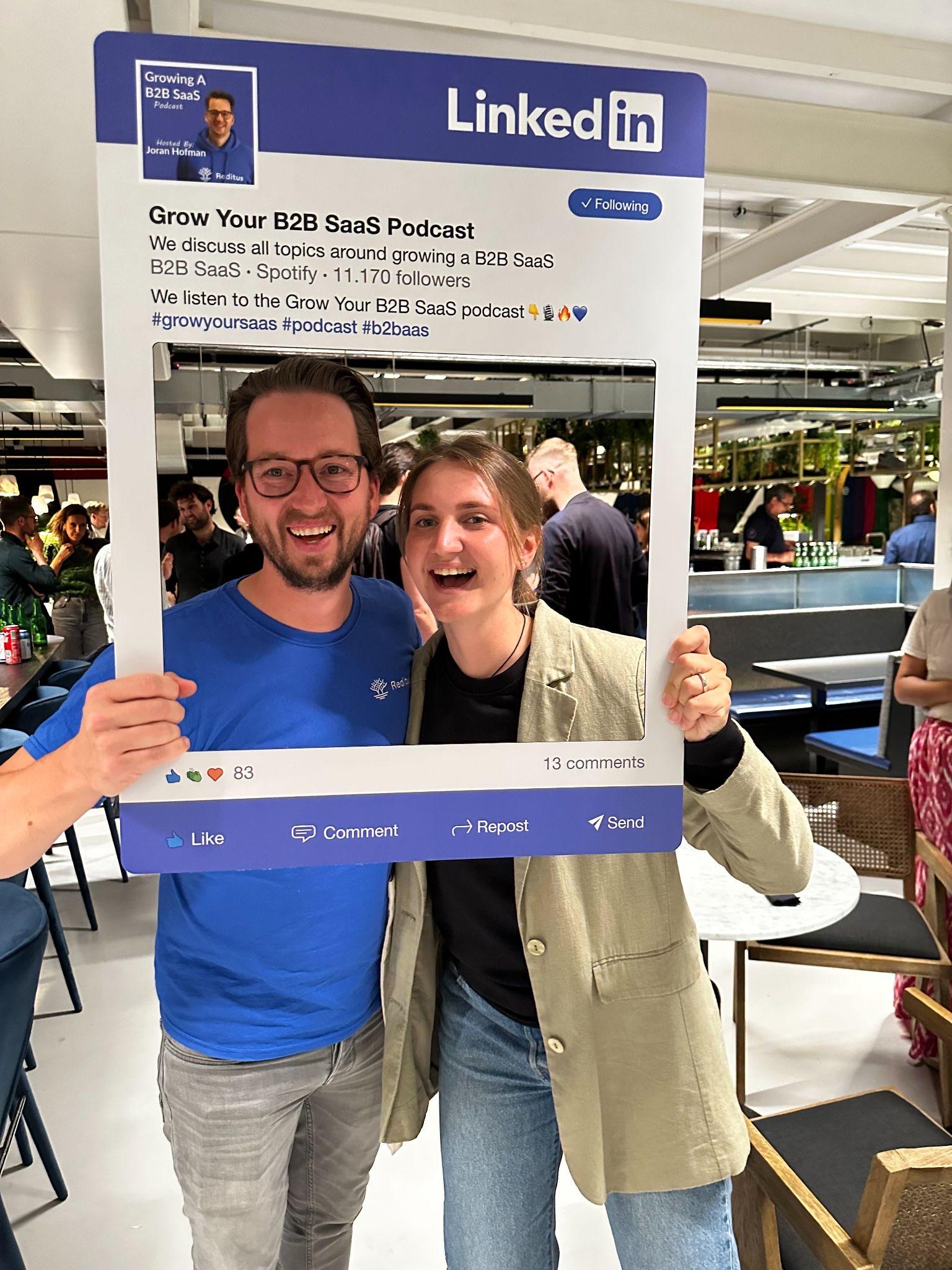 Joran Hofman and Romana Kuts posing with a LinkedIn frame at an event