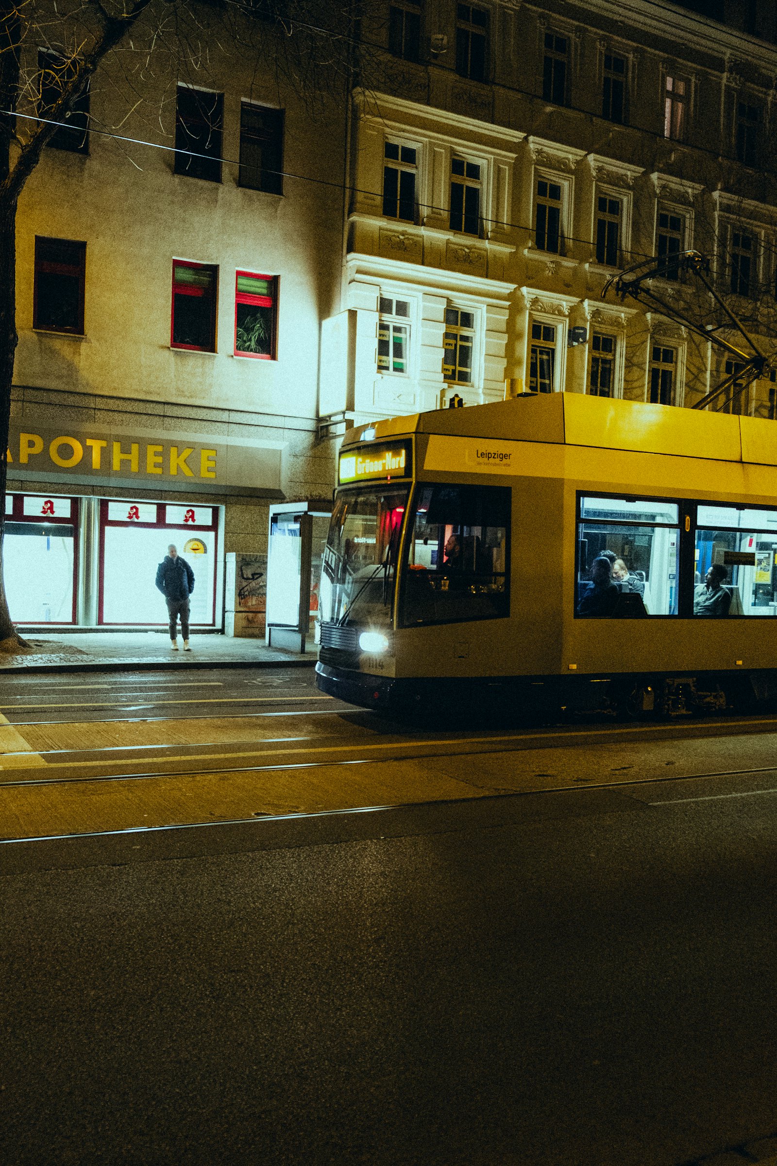 Leipzig street with a tram at night