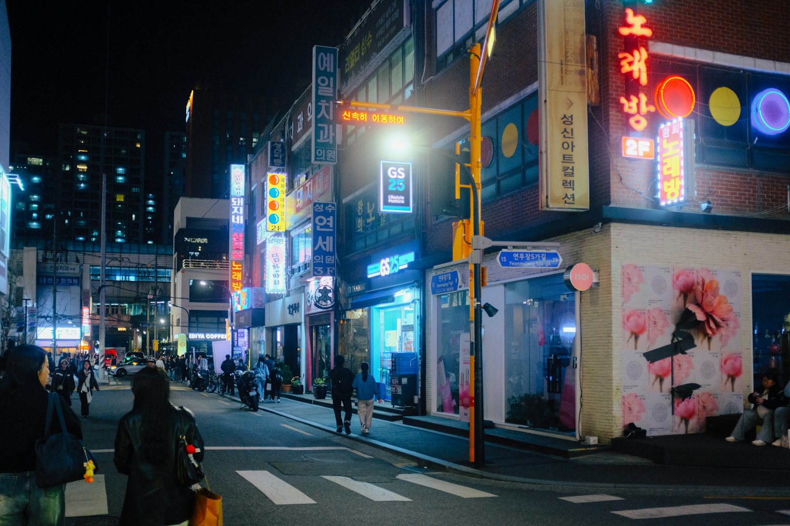 Neon signs on a street in Seoul at night