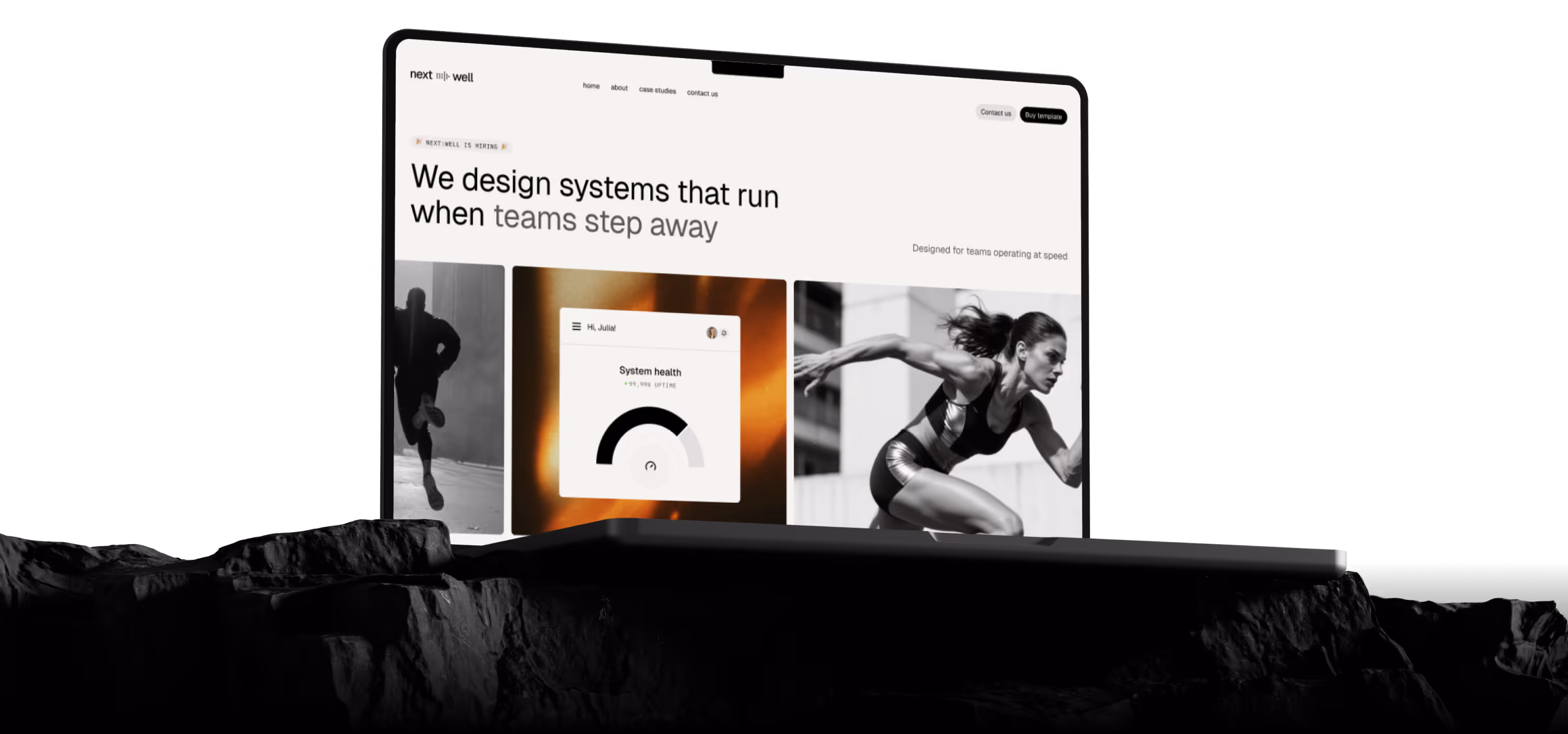 Laptop on a rocky surface displaying a website with the headline 'We design systems that run when teams step away' and images of a runner, a system health gauge, and a sprinting athlete.