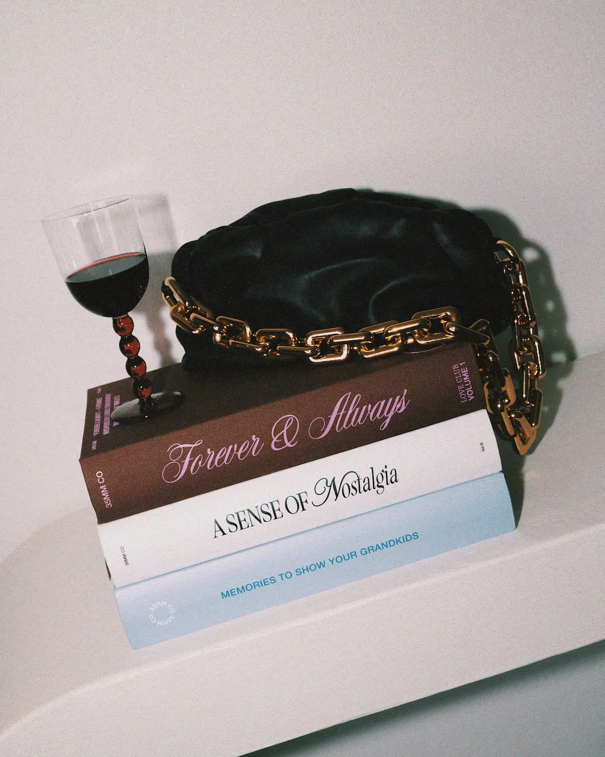 Stack of three books titled Forever & Always, A Sense of Nostalgia, and Memories to Show Your Grandkids.
