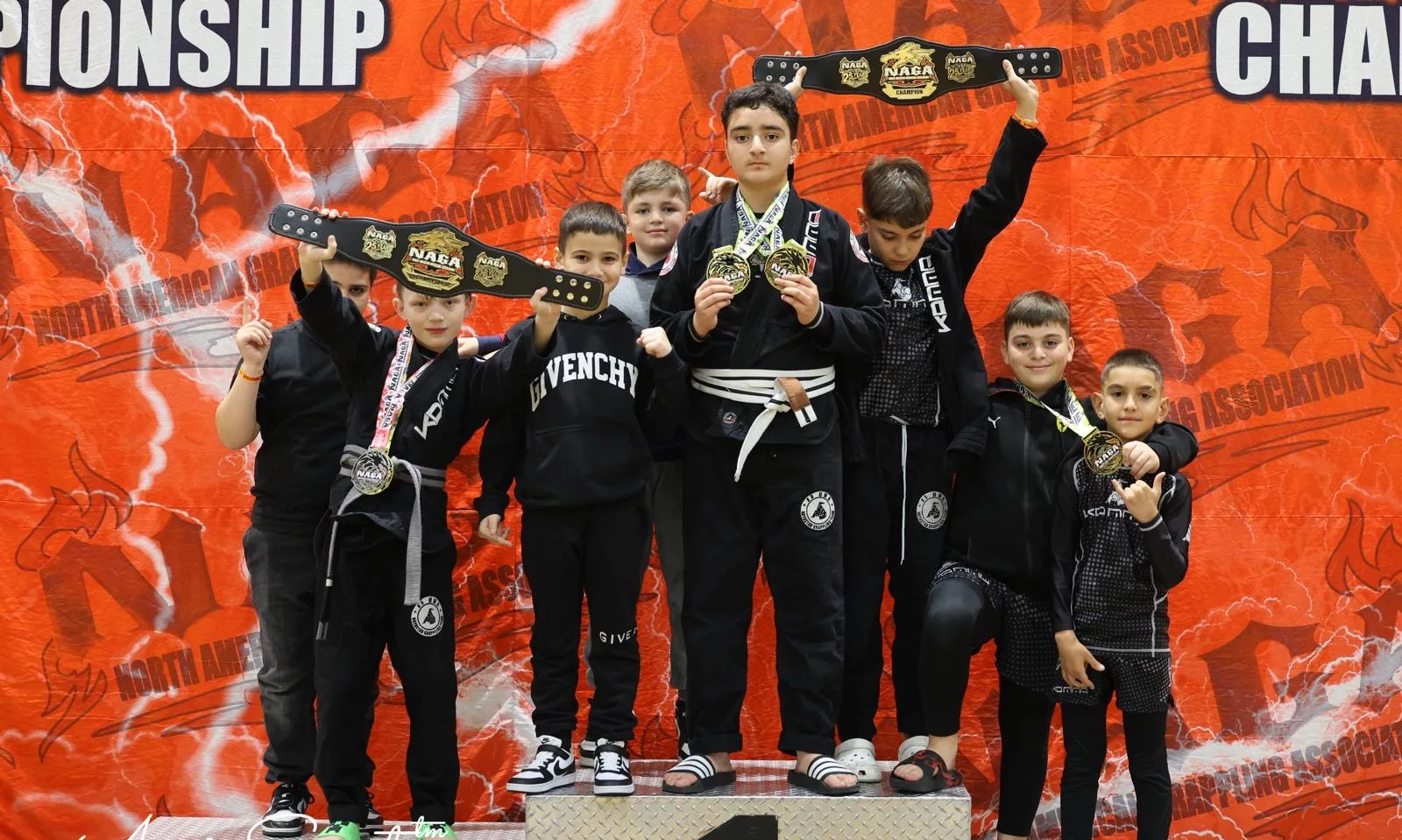 KD MMA kids grappling team on the podium at the NAGA championship