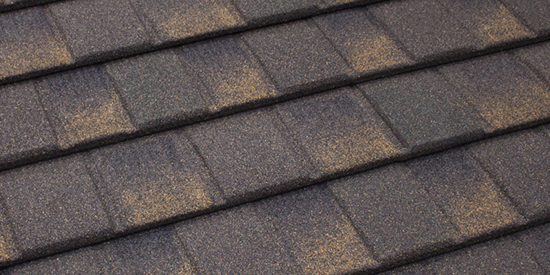 Close-up of Tilcor stone coated panel showing strength and stone texture