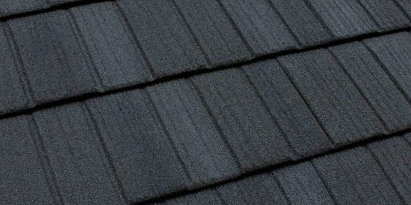 Tilcor charcoal blend cf shake stone coated metal roof panel showing natural stone coating
