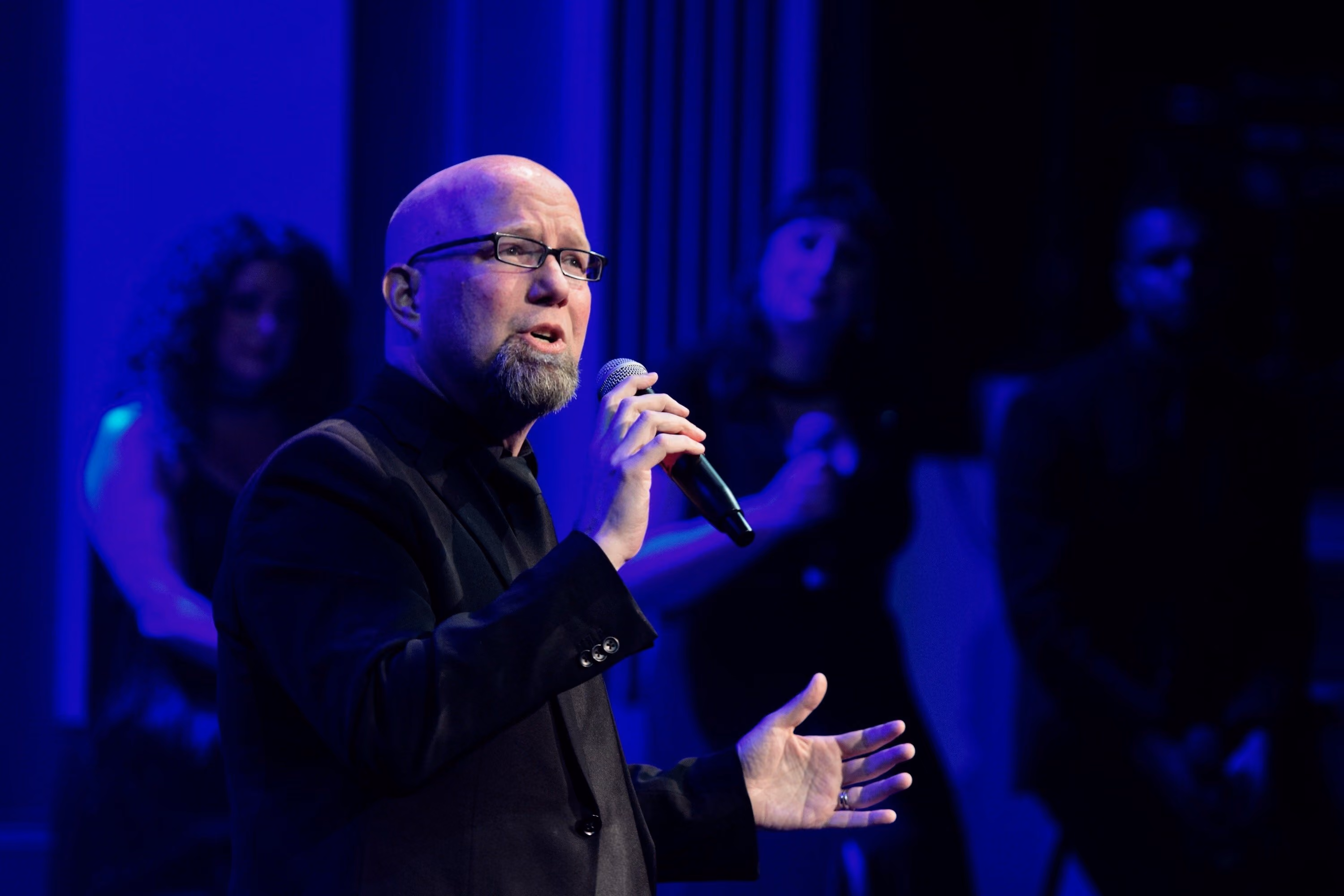 Scott Coulter holding a mic