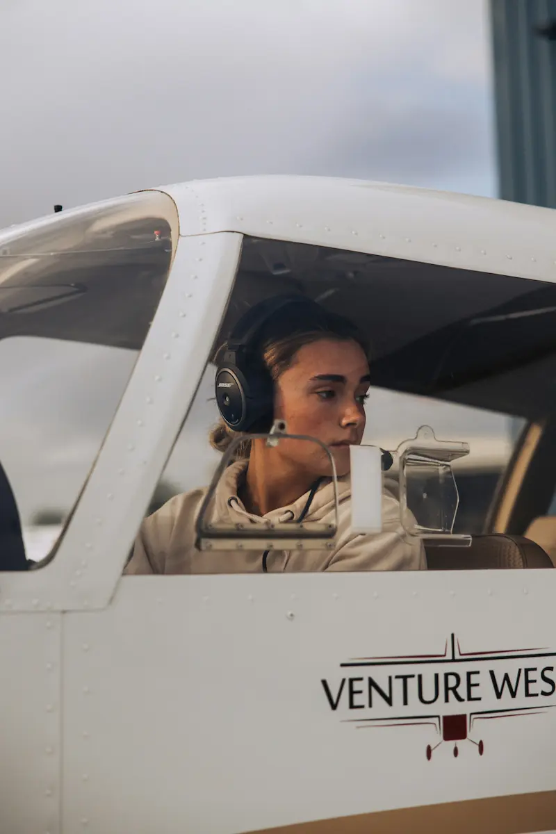 Student pilot in cockpit with headset