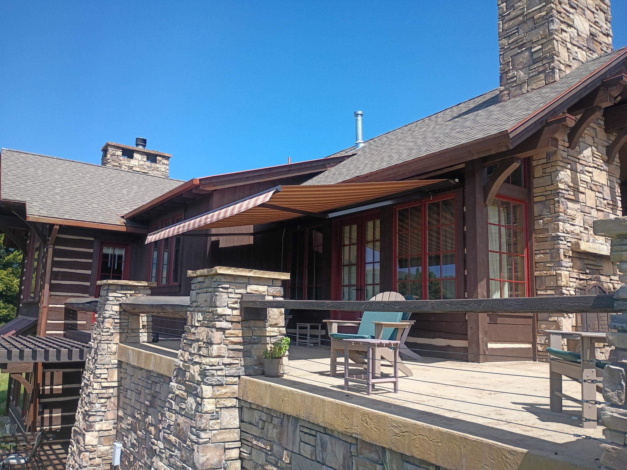 Retractable awning over a Montana deck