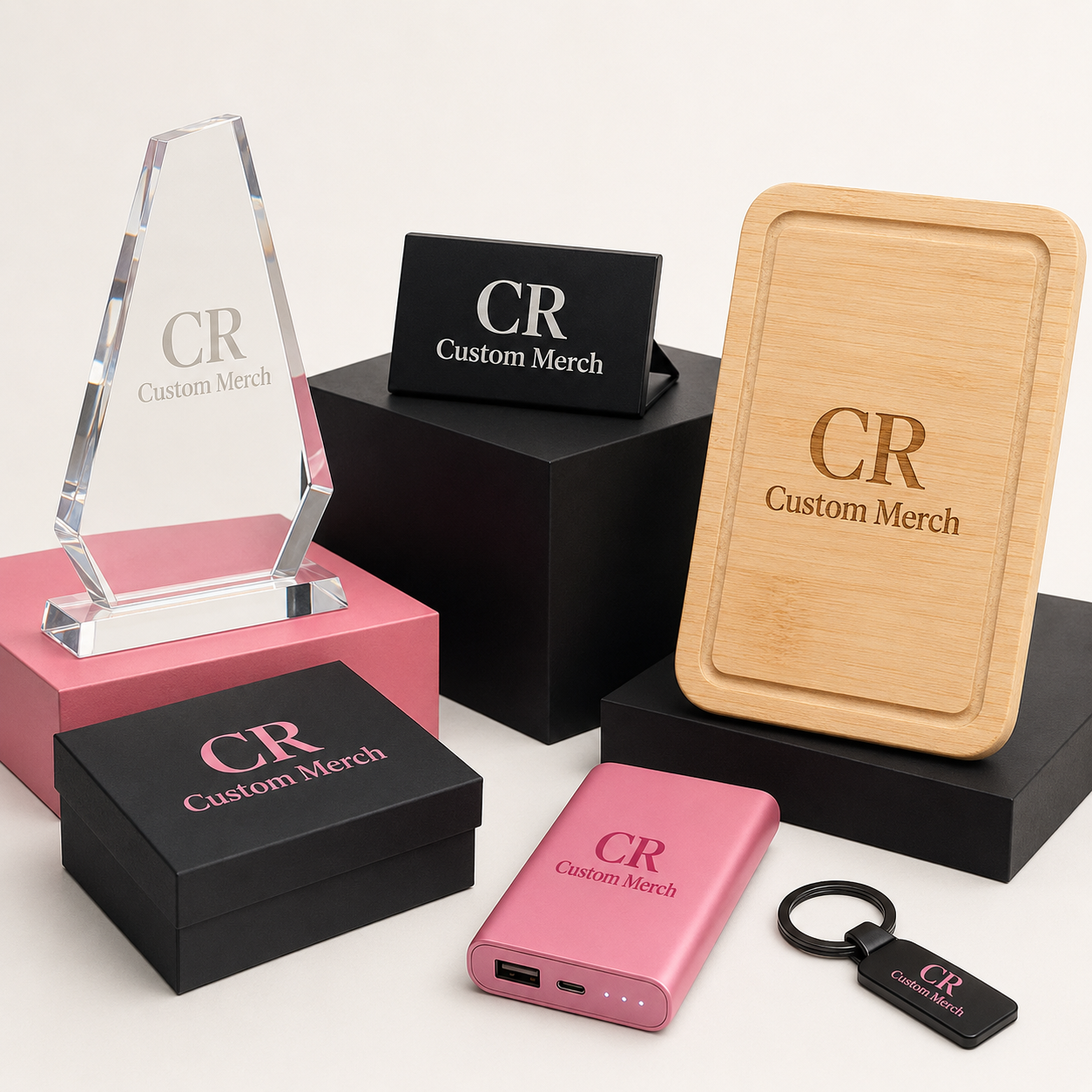 CR Custom Merch branded acrylic award, plaque, timber board, gift box, power bank and keyring in a studio display