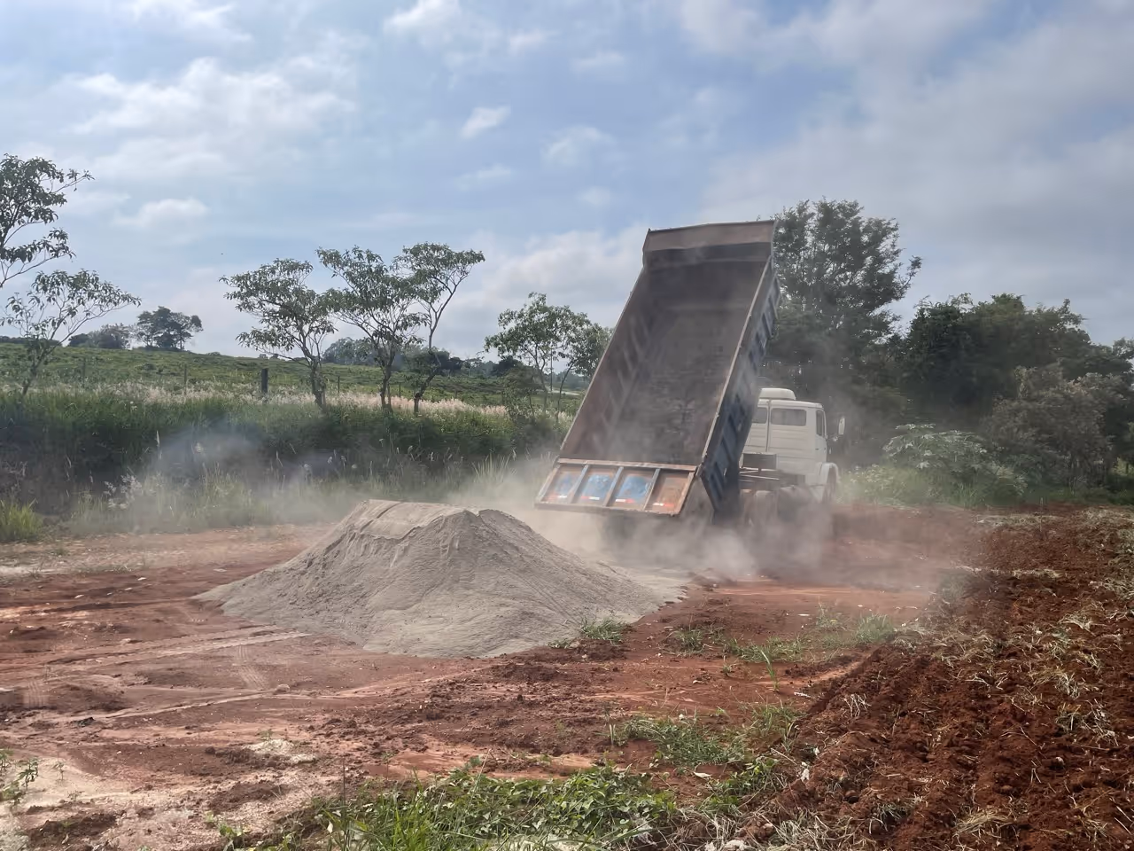 Photo of truck delivering rock powder