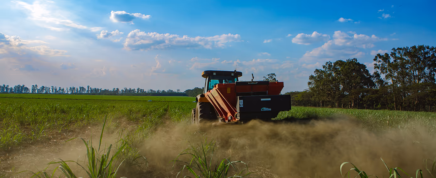 Tractor spreading rock powder