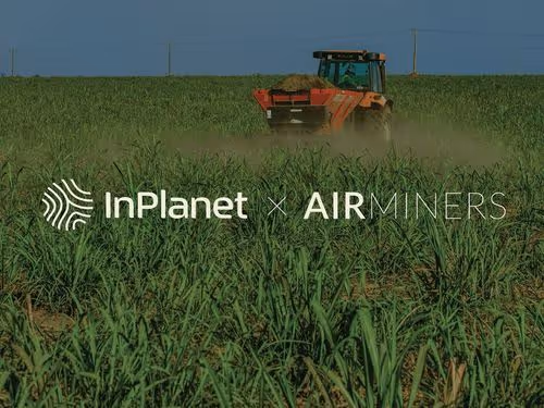 Agricultural machinery spreading crushed rock across cropland as part of an InPlanet and AirMiners carbon removal project.