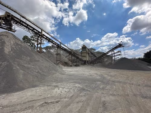 Mining equipments grinding rock powder. Piles of rock powder in the forefront.|Photos of Guimarães, Leonardos, and Theodoro