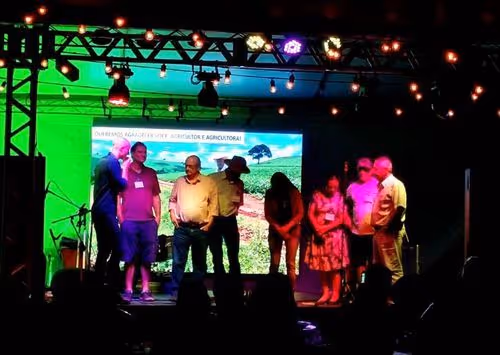 InPlanet COO Niklas Kluger with farmers on stage at community event