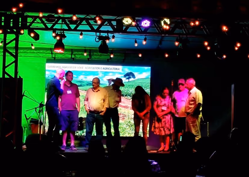 InPlanet COO Niklas Kluger with farmers on stage at community event