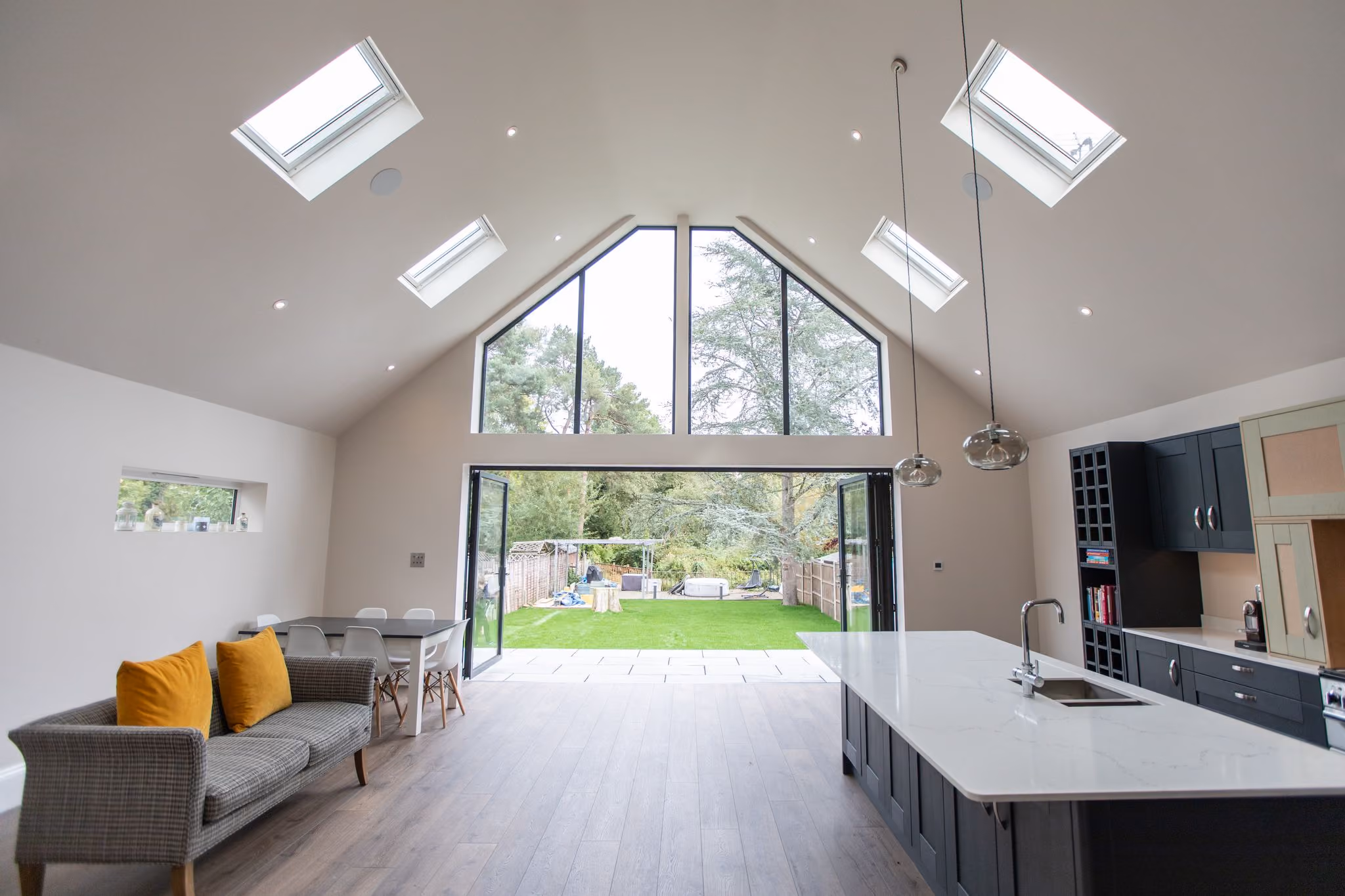 Vaulted rear extension with apex glazing and bifold doors opening onto the garden