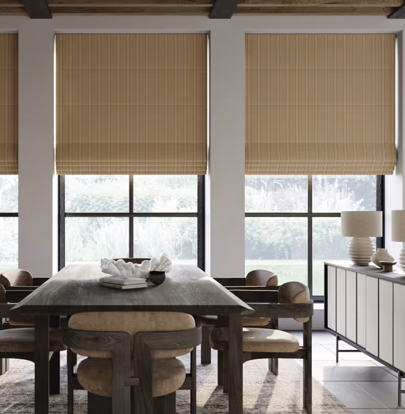 Modern dining room with large windows, beige Roman shades, dark wood table, and beige cushioned chairs.