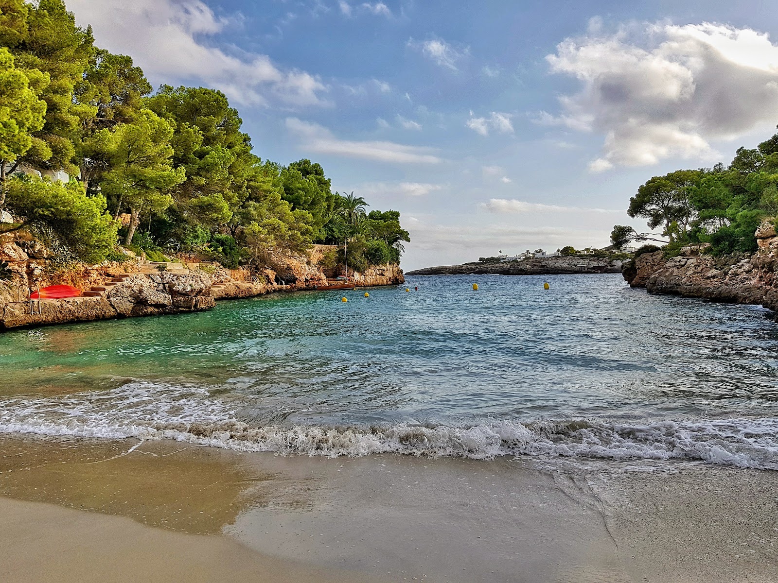 Cala Serena beach near Cala d’Or with clear water and rocky cliffs
