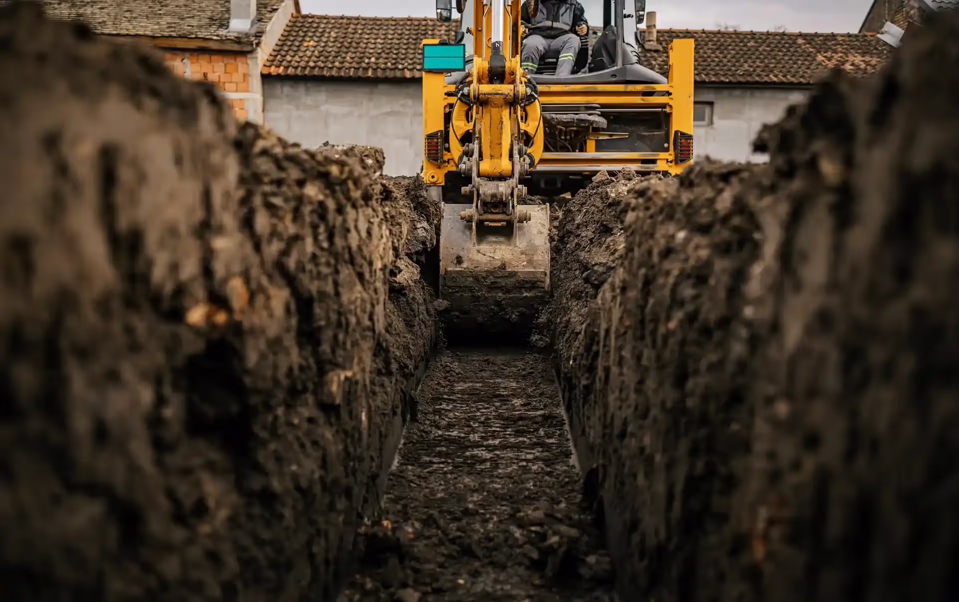 Digger digging a trench