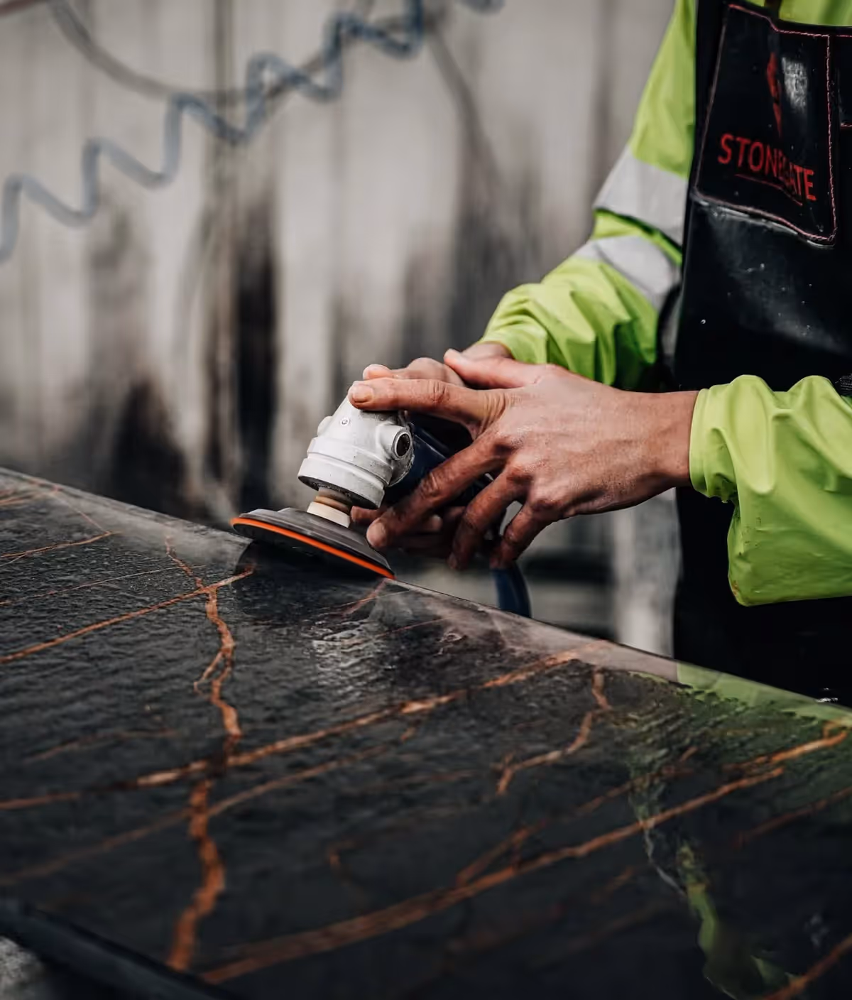 Worker wet polishing worktop